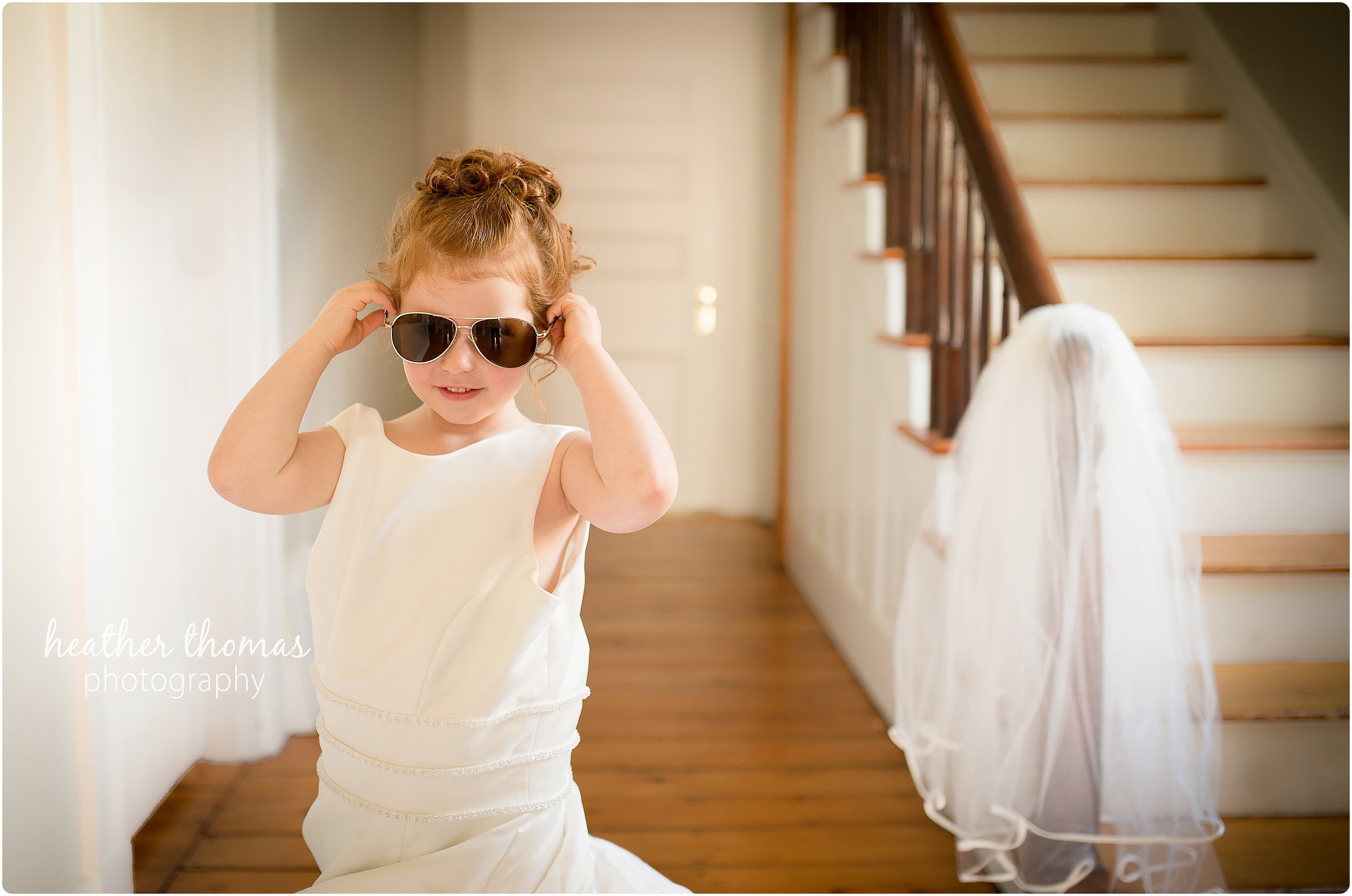 In Your Wedding Dress Portraits girl wearing her mothers wedding dress in a foyer of an old home