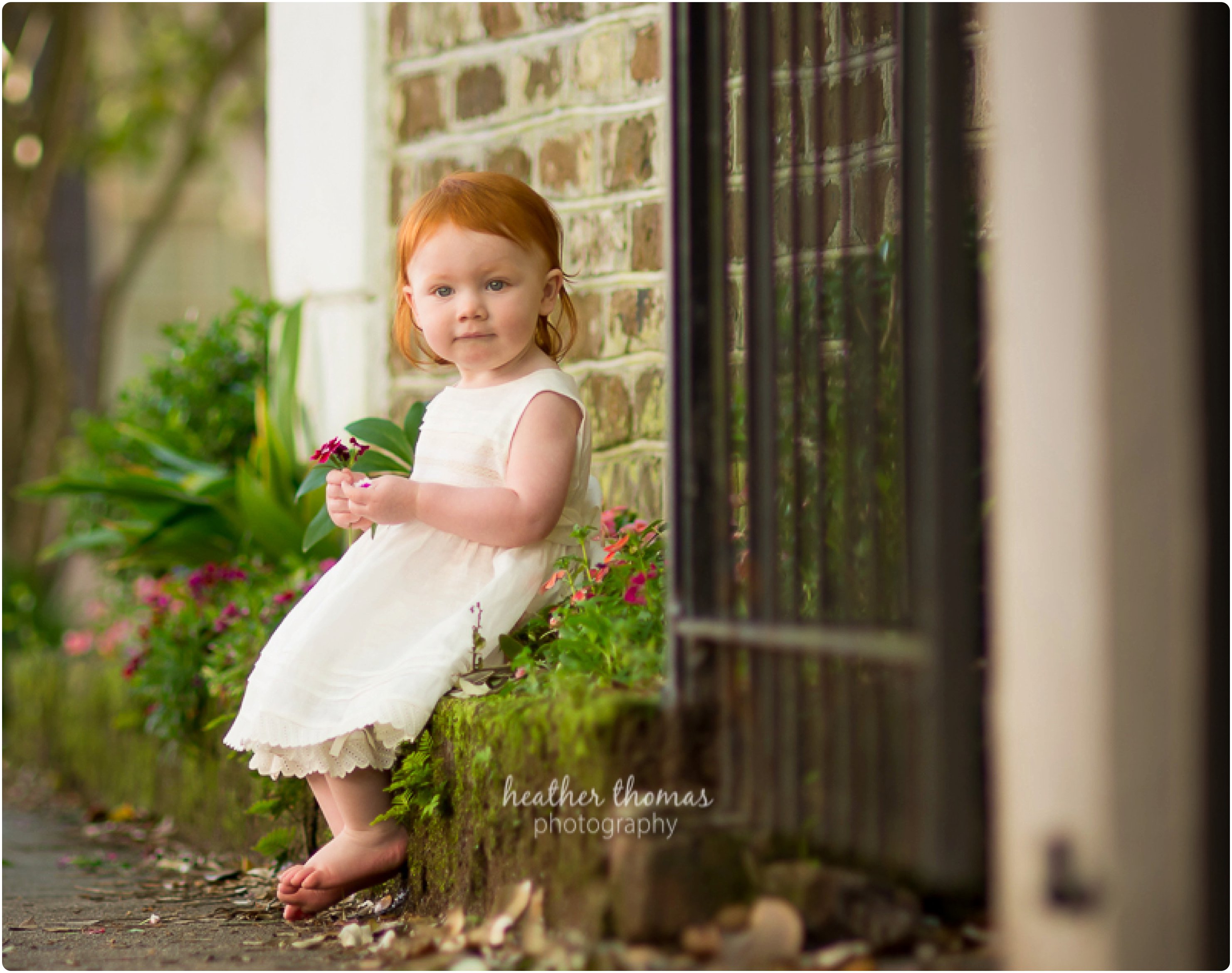 What to Wear for a Family Photo Shoot // Philadelphia Family Photography girl walking downtown charleston in white outfit photos by heather thomas photography