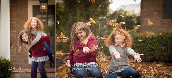 The B Family | Newtown, PA Family Photography family in maroon and jeans outside in the fall throwing leaves