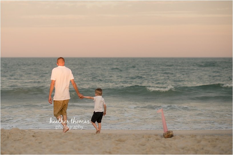 ocean-city-nj-beach-photographers-56.jpg dad and son walking on the beach