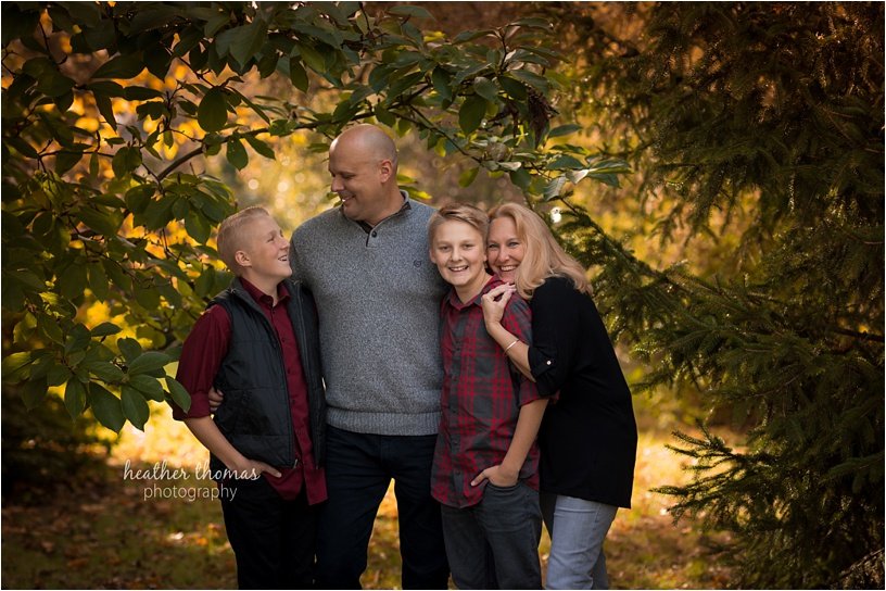 fall photo shoot philadelphia-44.jpg brothers wearing maroon and black with their parents outside for a fall photo shoot in newtown pa