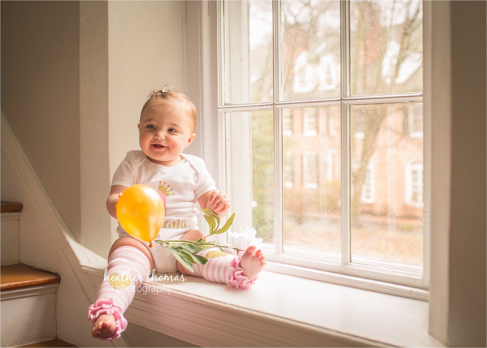 bucks county first birthday photographer-44.jpg a picture of an 11 month old sitting in a window with leggings on heather thomas photography