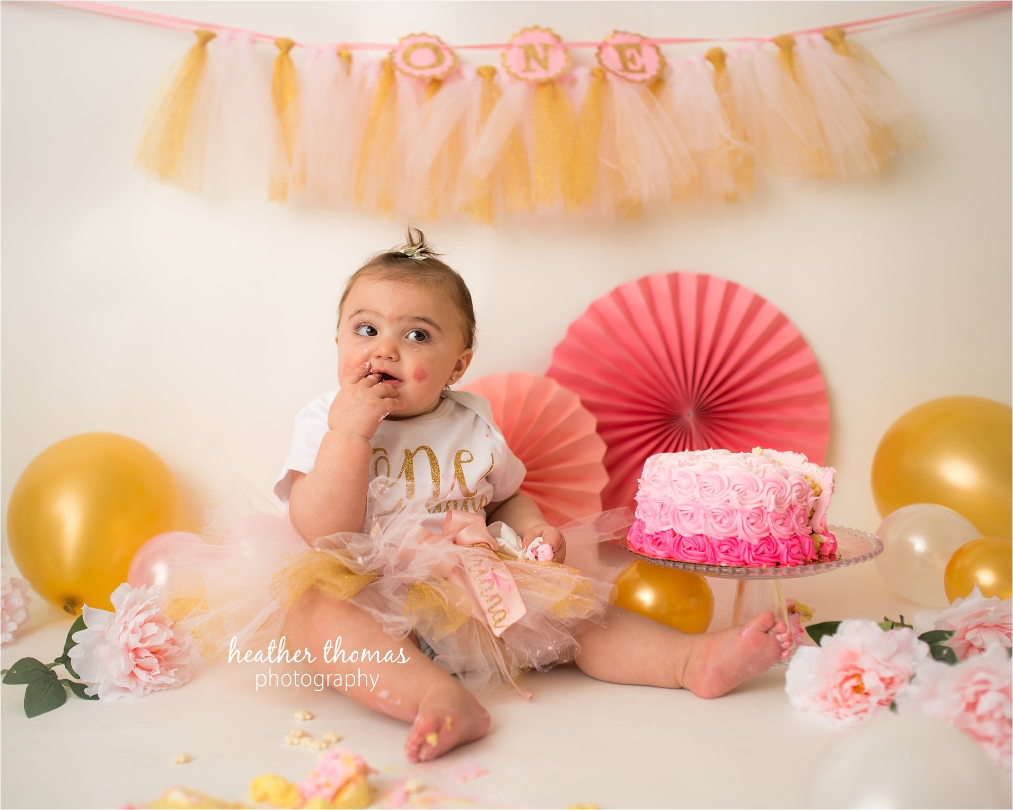 bucks county first birthday photographer-66.jpg a one year old eating cake with heather thomas photography in a newtown pa