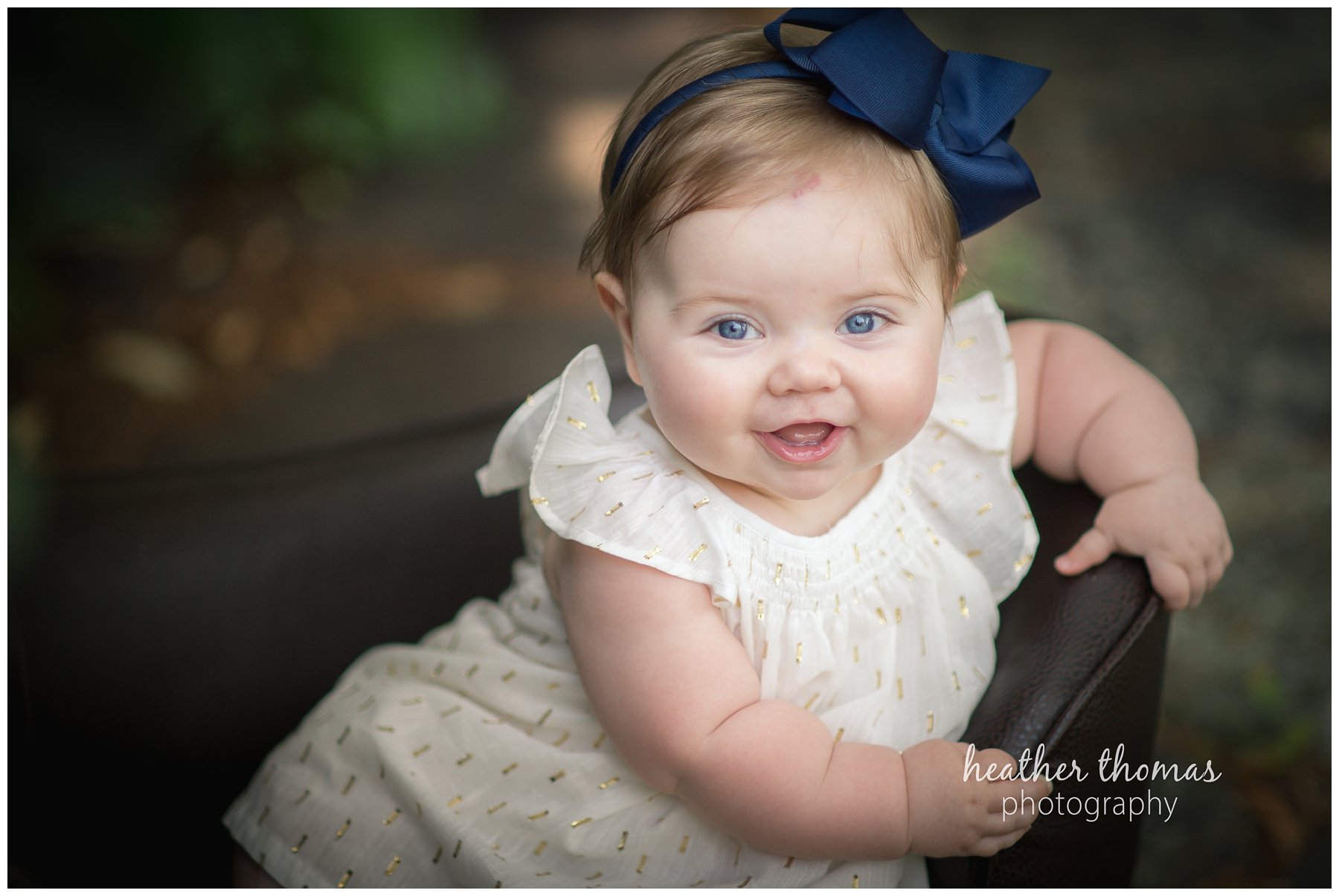 baby photo shoot philadelphia-34.jpg a closeup of a 7 month old baby smiling at the camera in newtown pa