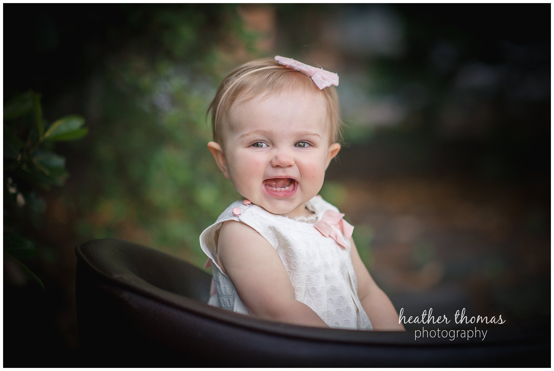 bucks county baby portraits-13.jpg an 8 month old baby smiling for the camera in philadelphia pa