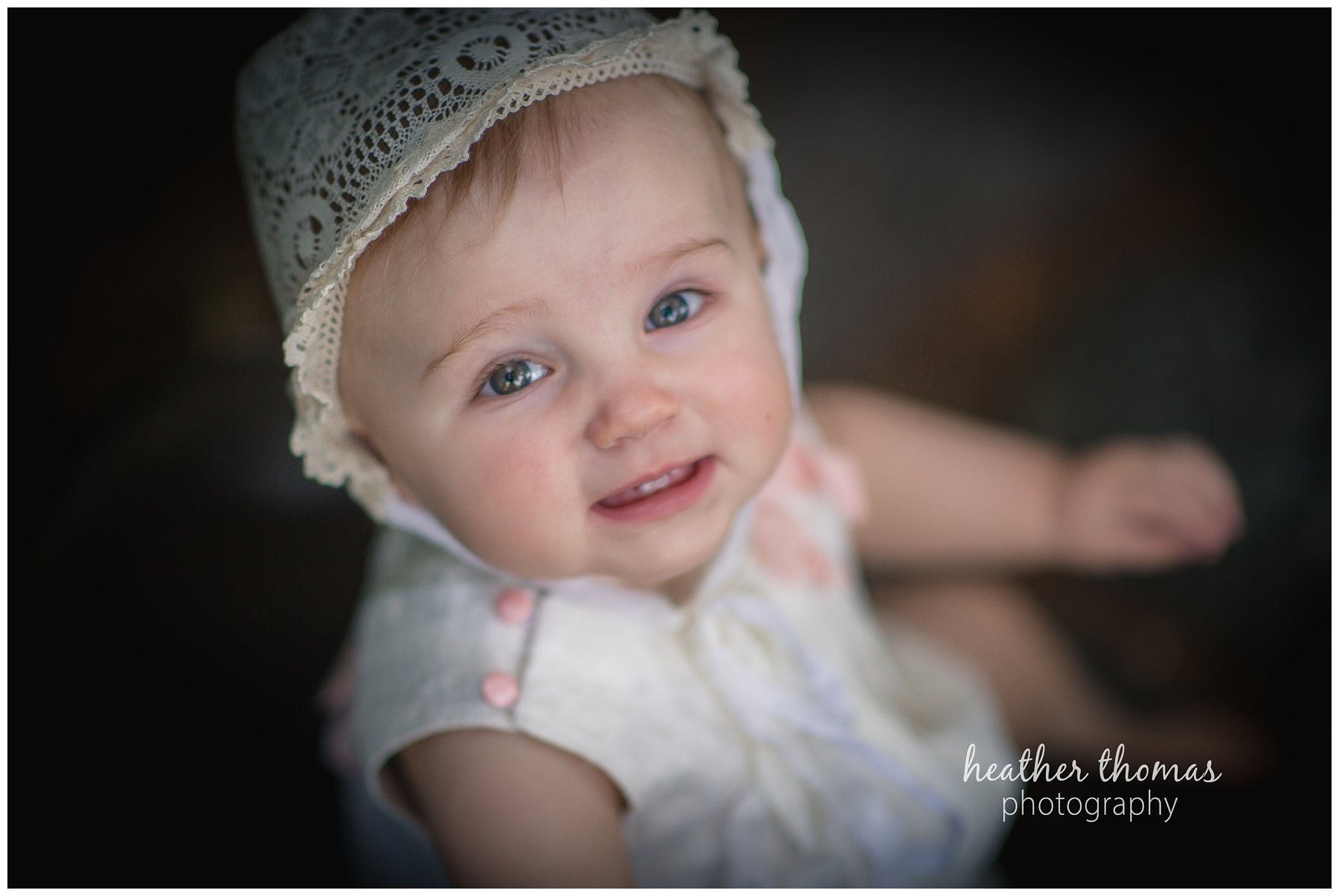 bucks county baby portraits-16.jpg an 8 month old baby smiling for the camera in philadelphia pa