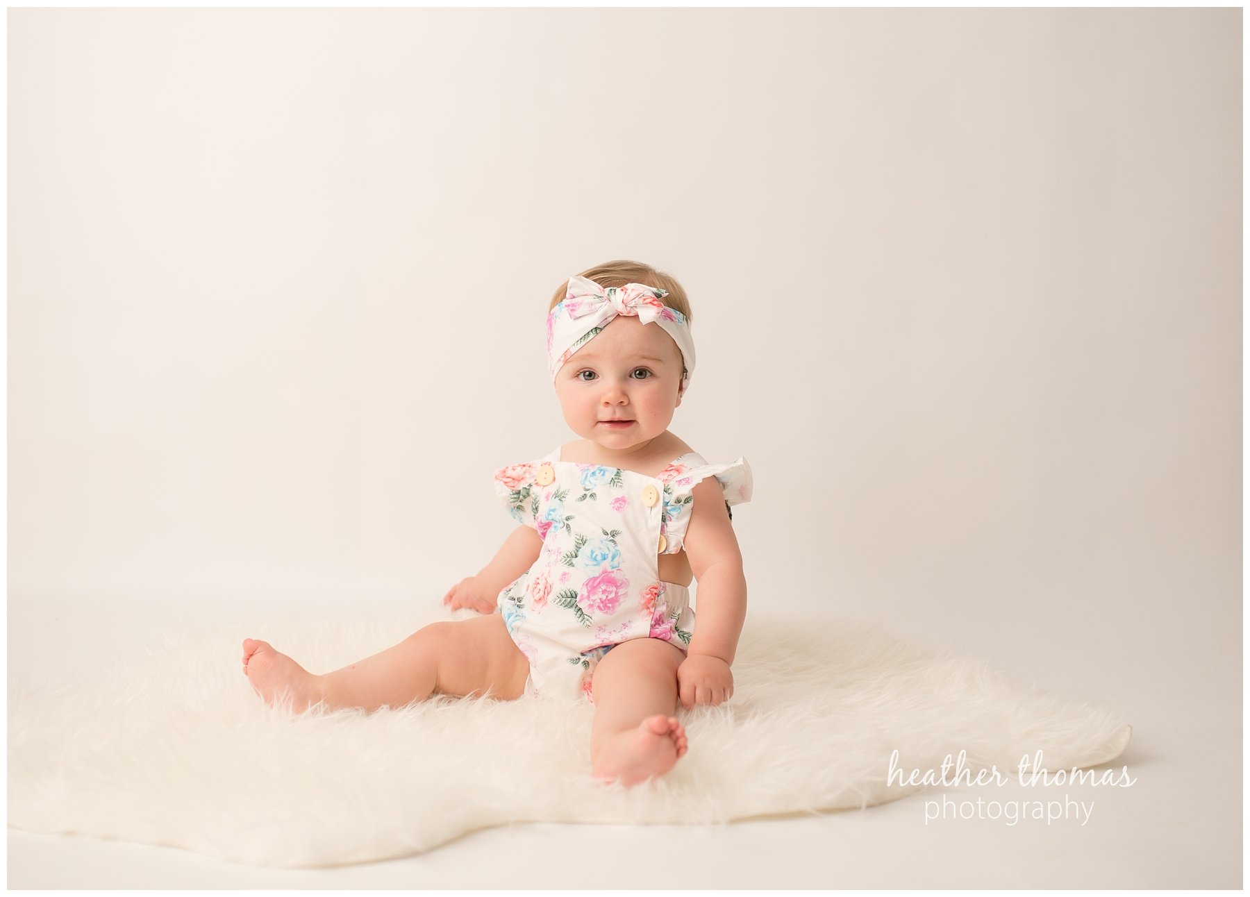 bucks county baby portraits-18.jpg an 8 month old baby smiling for the camera in philadelphia pa