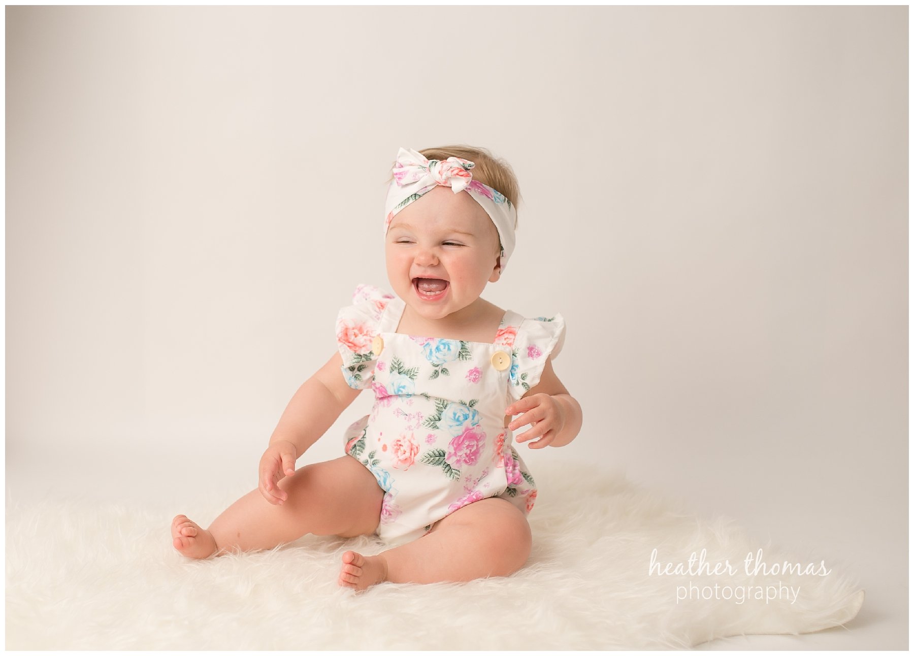 bucks county baby portraits-20.jpg an 8 month old baby smiling for the camera in philadelphia pa