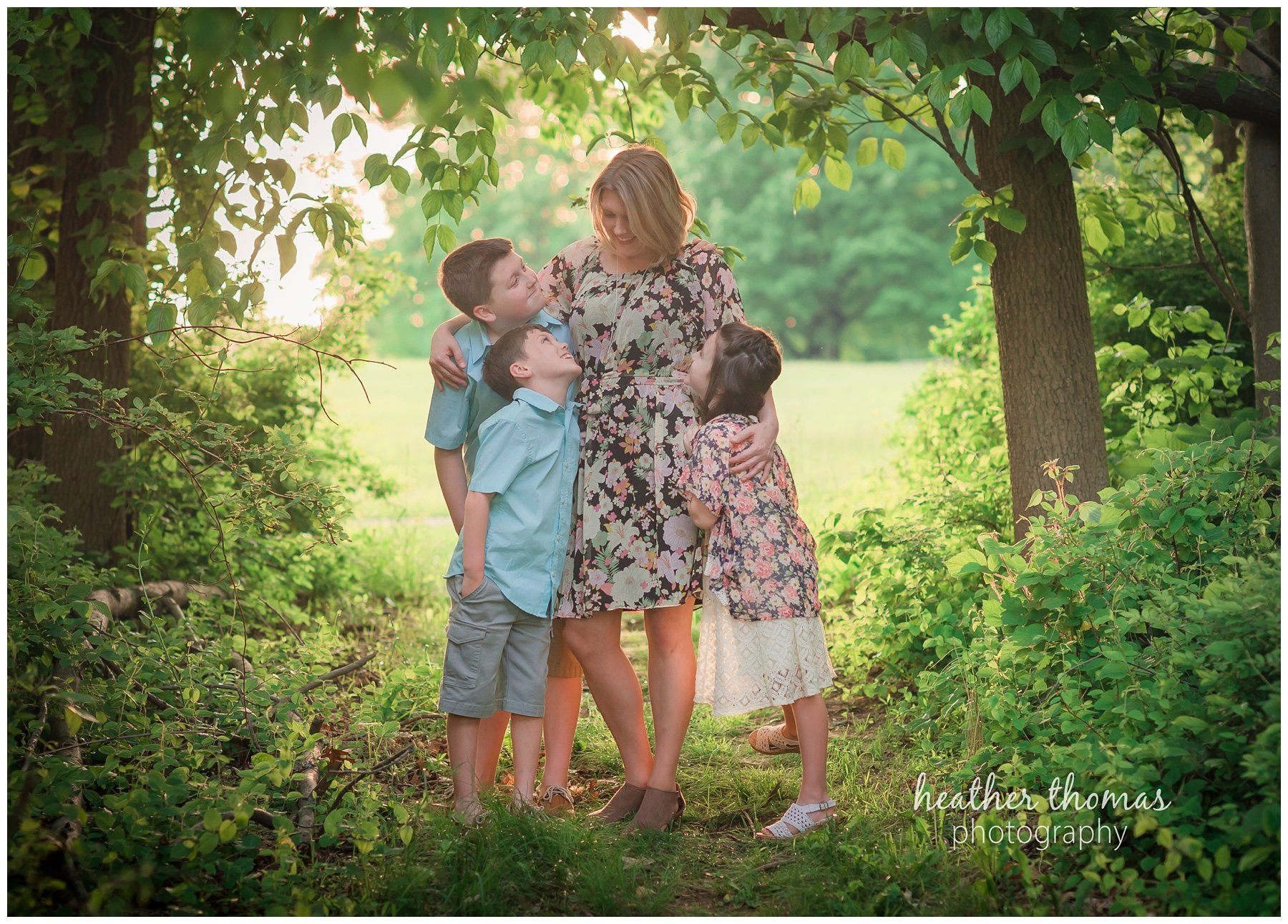core creek family portrait-14.jpg a photo of a mother and her thra picture of a mother walking down the path with her three kids at core creek park with her children at core creek park in langhorne pa