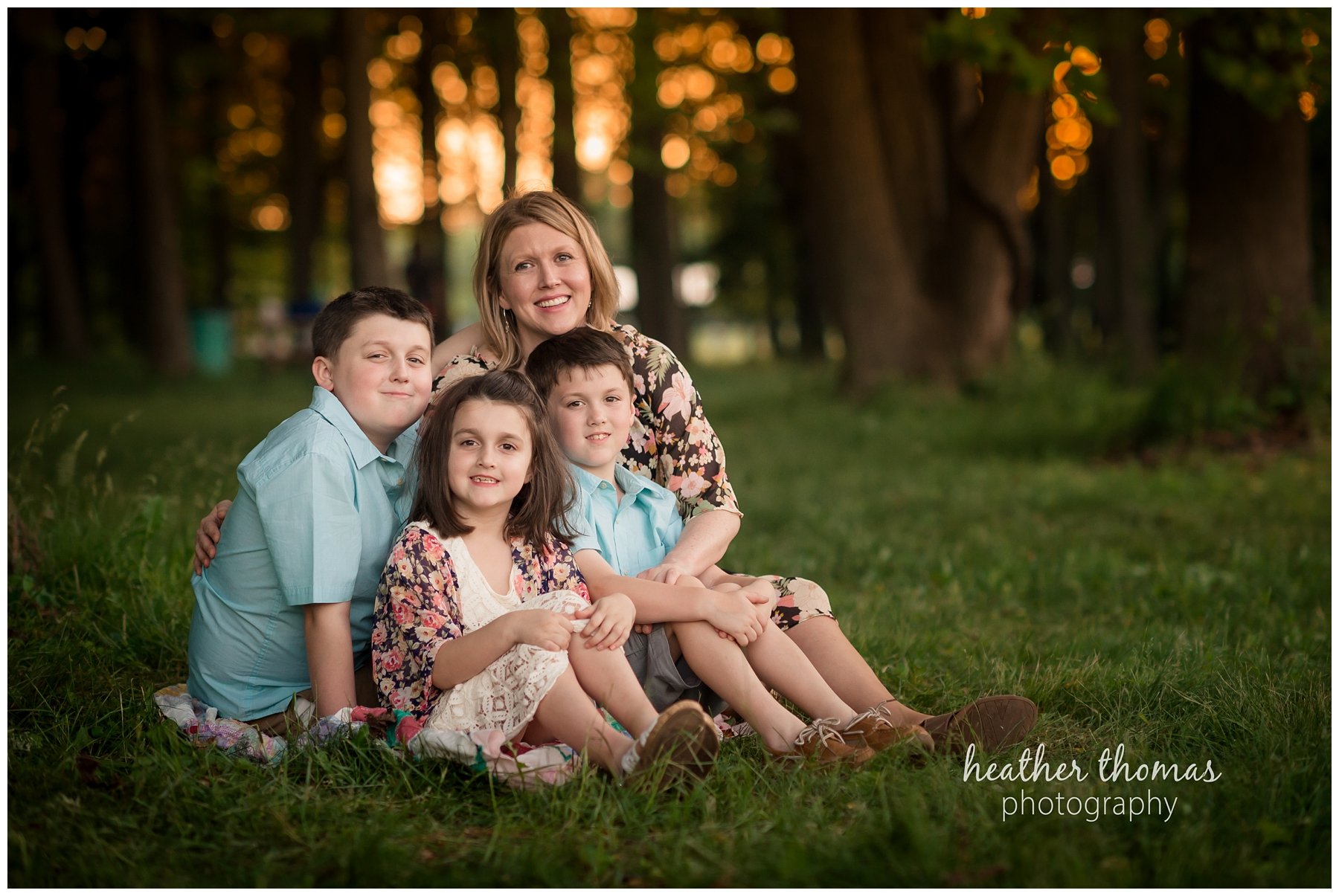 core creek family portrait-44.jpg a photo of a mother hugging her three children at core creek park in langhorne pa