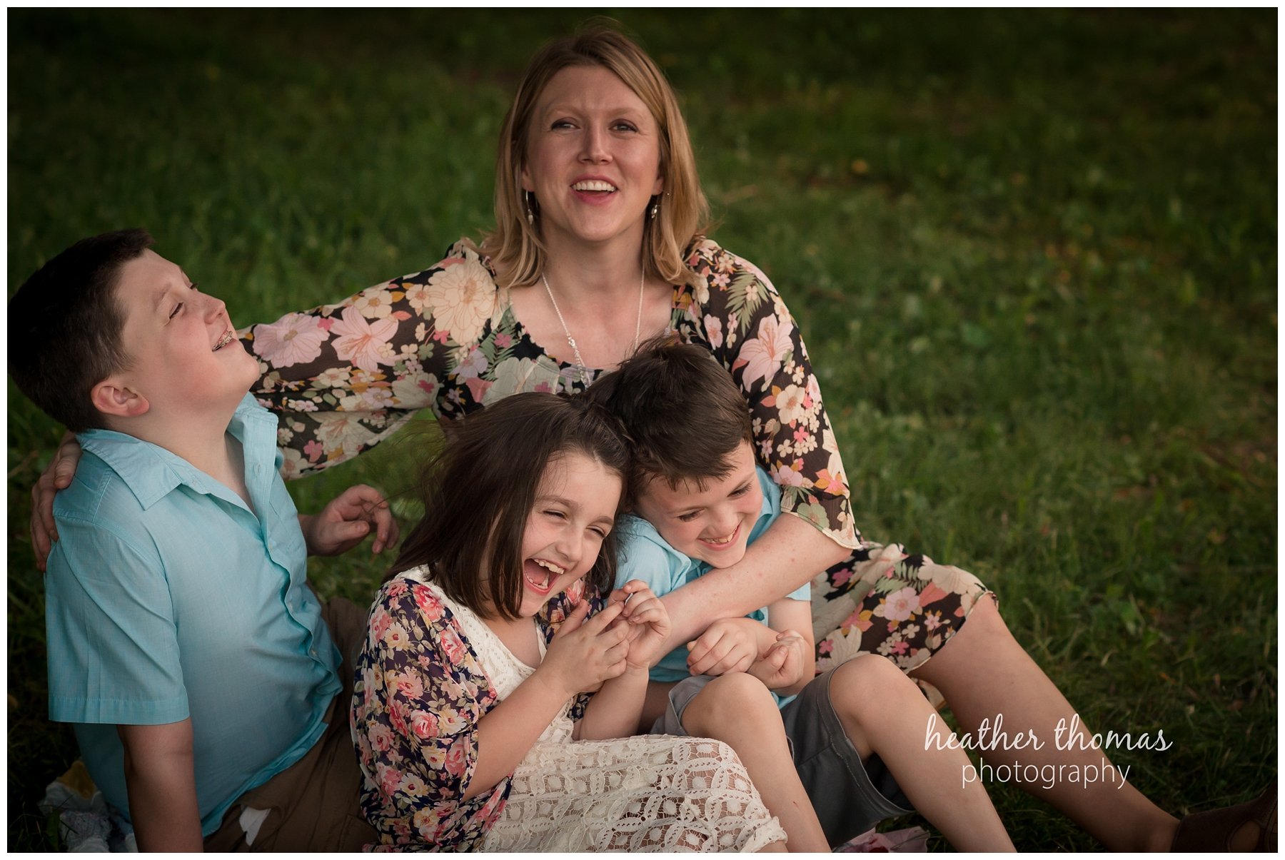core creek family portrait-49.jpg a closeup picture of a mom tickling her three kids outside in bucks count oa