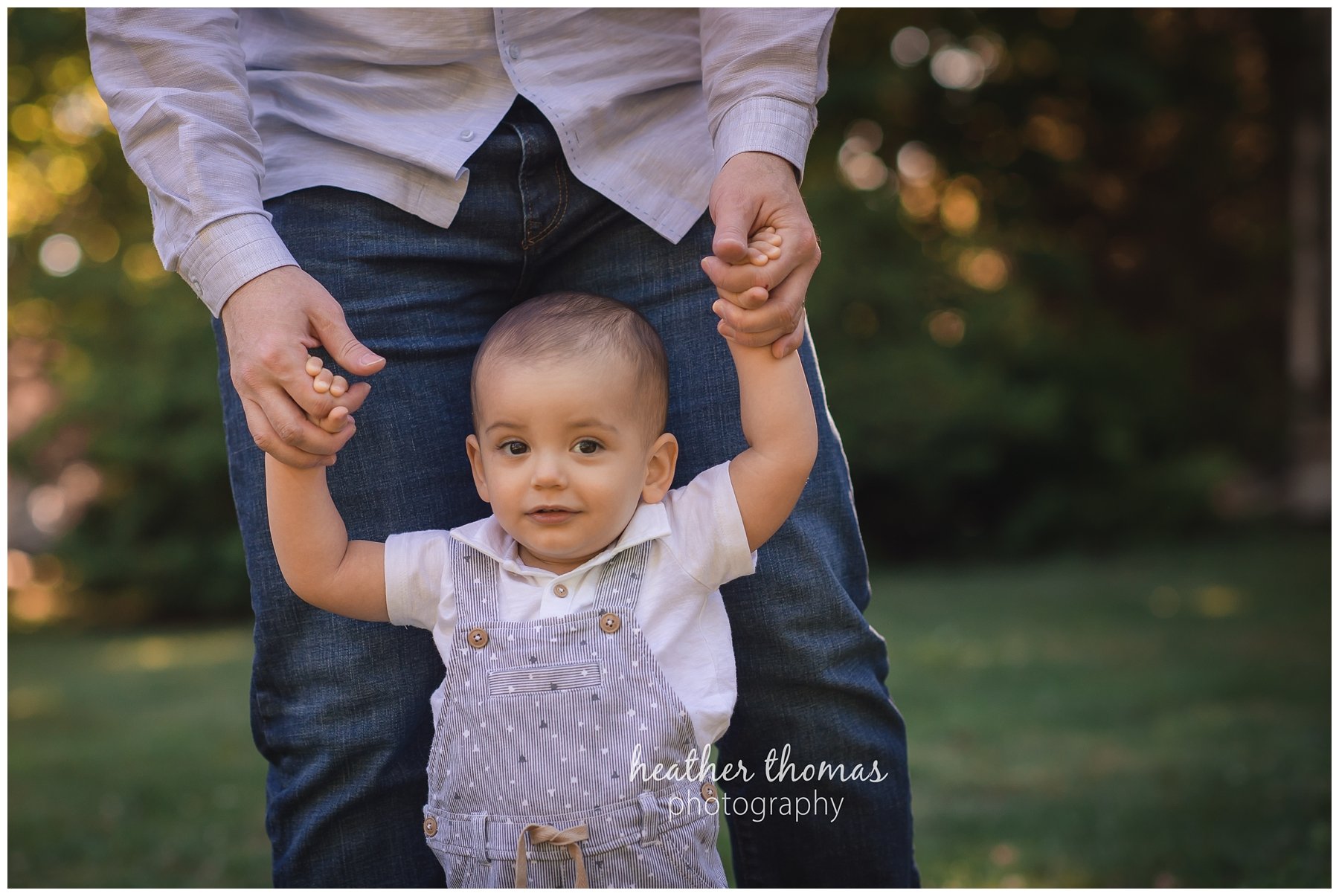 first birthday cake smash pesola-17.jpg a family of three with their one year old boy at their photography session in Newtown