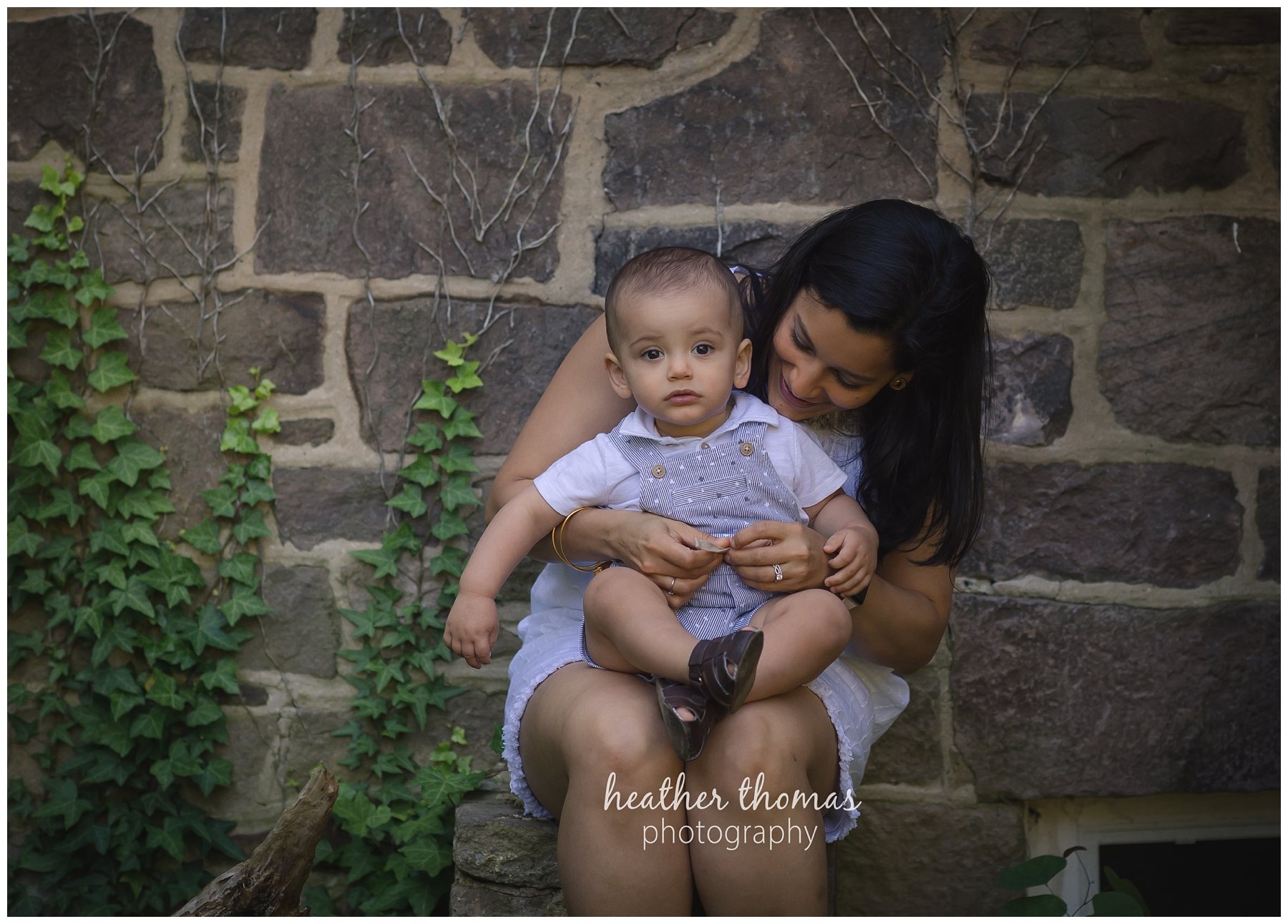 first birthday cake smash pesola-18.jpg a family of three with their one year old boy at their photography session in Newtown