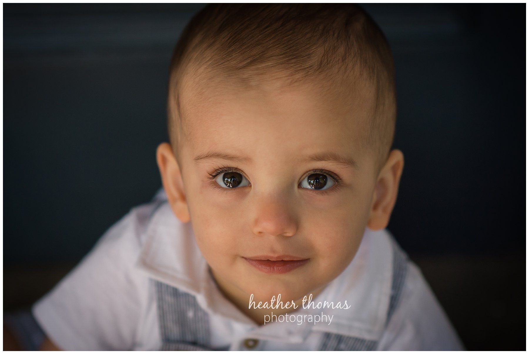 first birthday cake smash pesola-6.jpg a family of three with their one year old boy at their photography session in Newtown