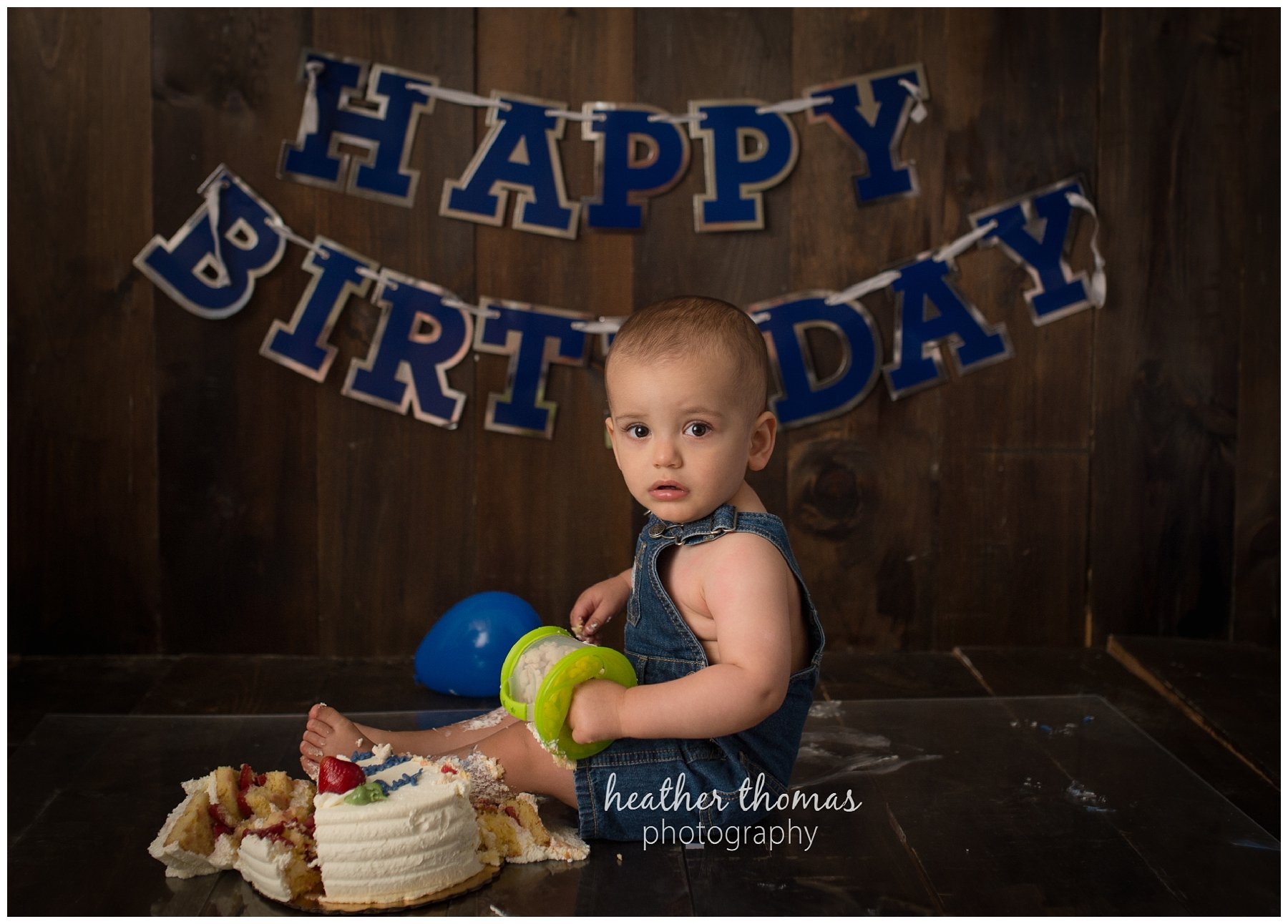 first birthday cake smash pesola-61.jpg a family of three with their one year old boy at their photography session in Newtown