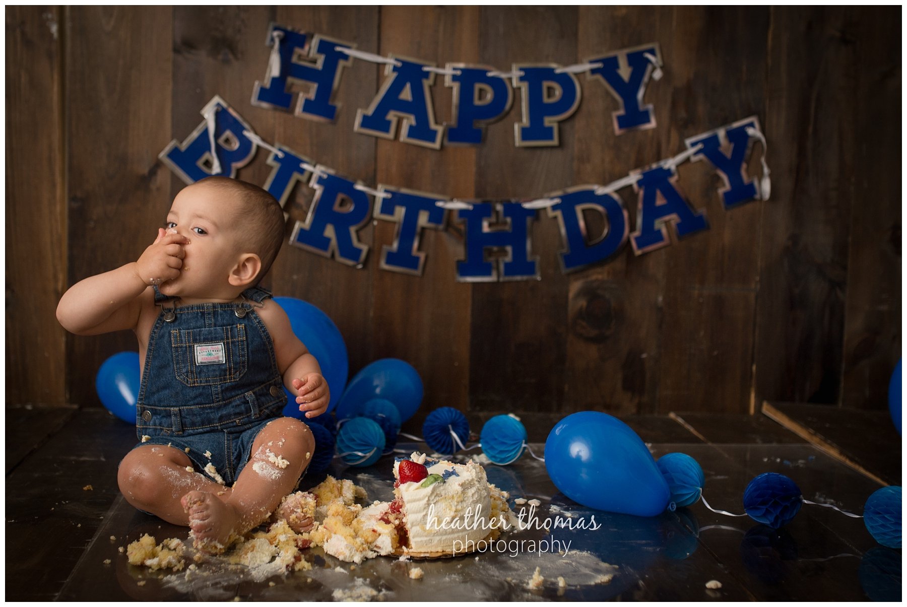 first birthday cake smash pesola-66.jpg a family of three with their one year old boy at their photography session in Newtown