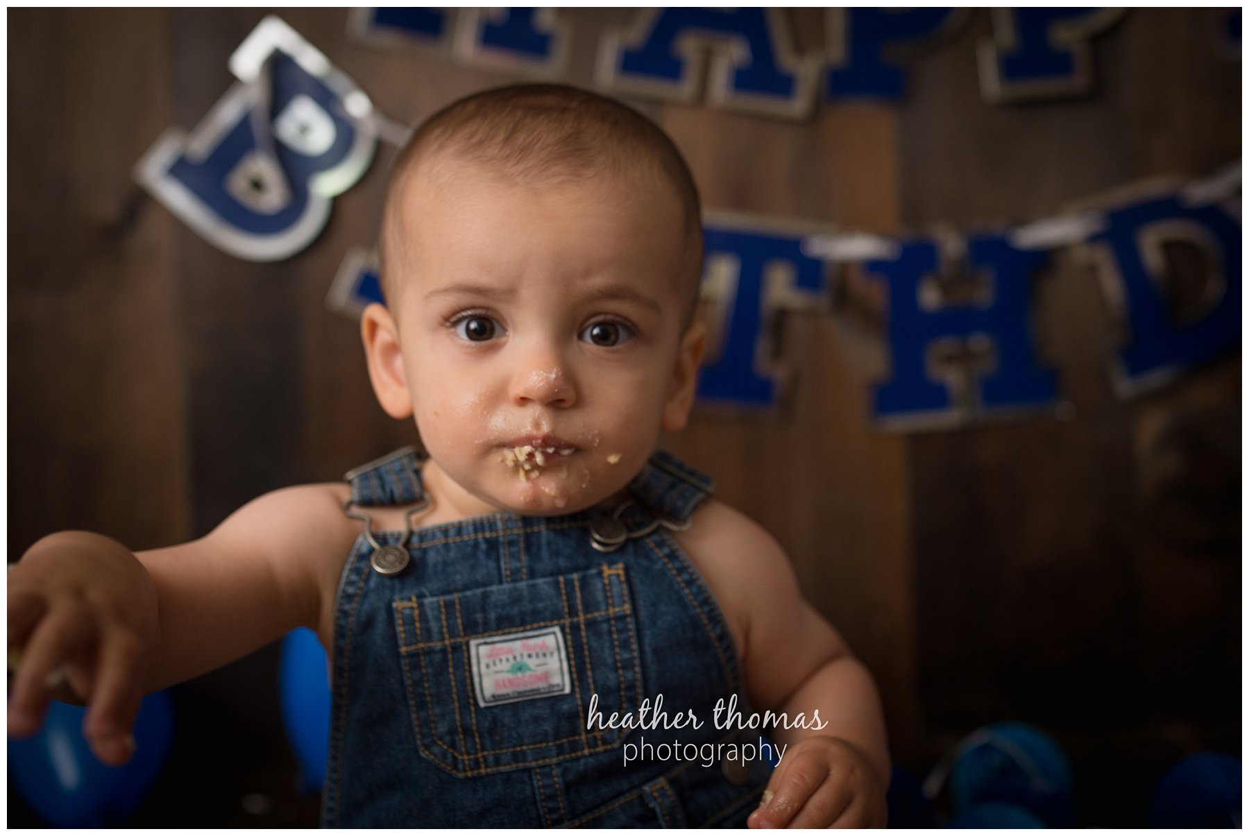 first birthday cake smash pesola-69.jpg a family of three with their one year old boy at their photography session in Newtown