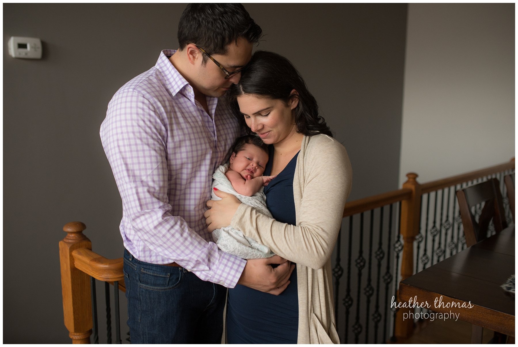 philadelphia lifestyle portraits-18.jpg photographs of a family of three in their home during their newborn photography session with heather thomas photography