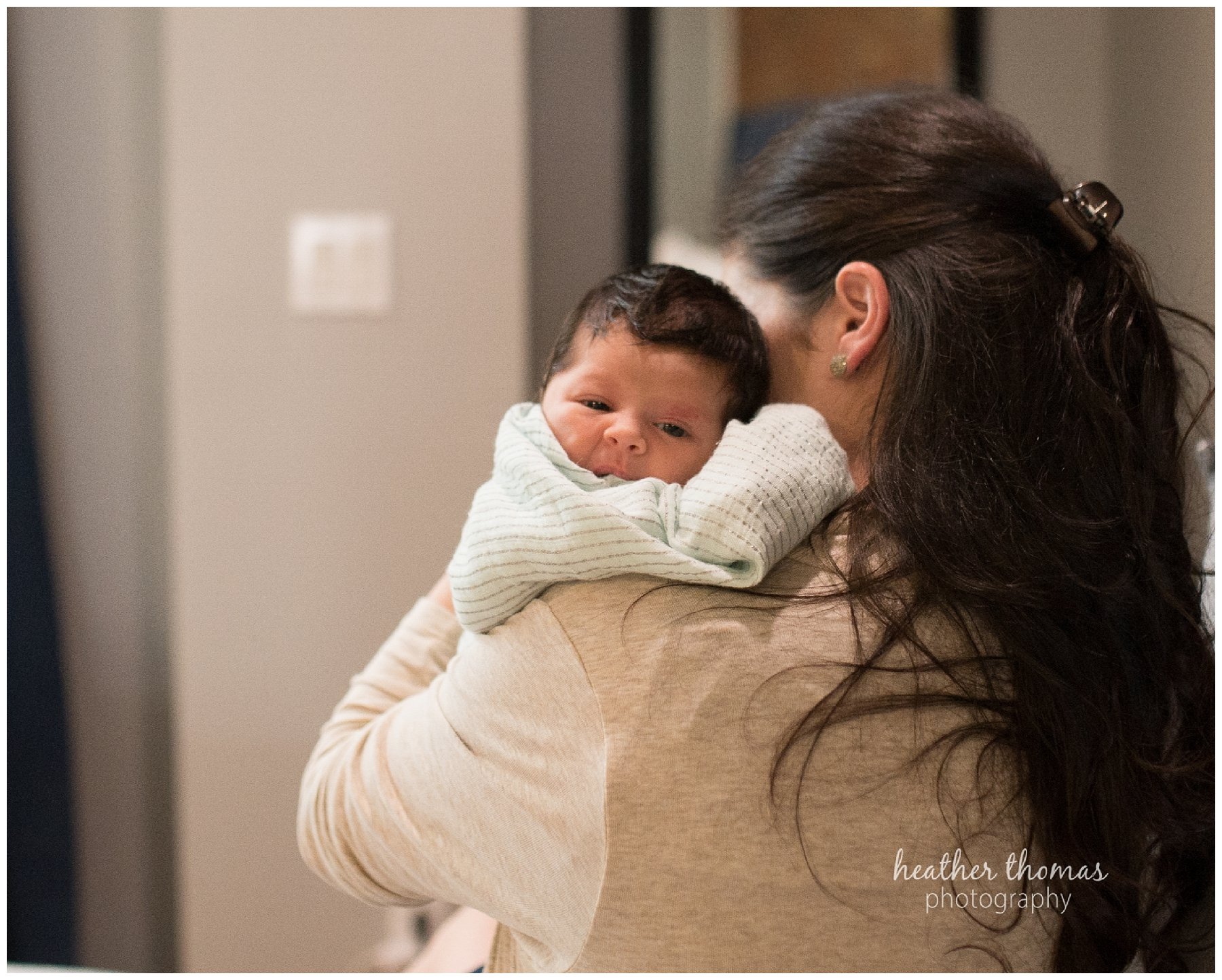 philadelphia lifestyle portraits-81.jpg a mother holding her baby at a newborn lifestyle photography session in philadelphia with heather thomas photography