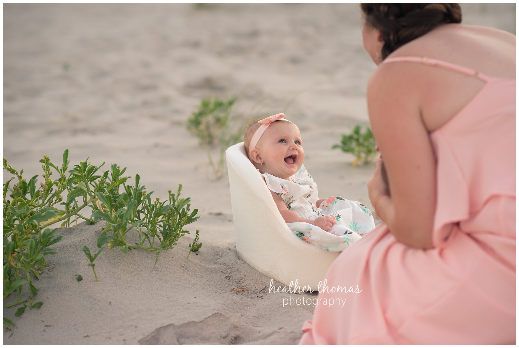 family beach photography ocnj-41.jpg a mother looking at her 5 month old baby in OCNJ