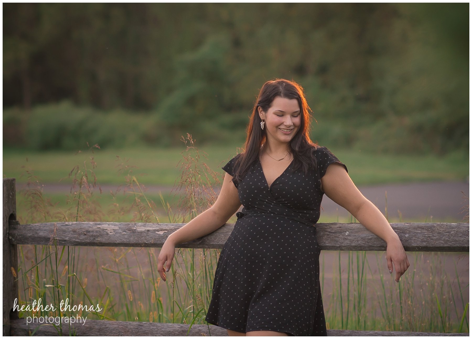 Senior Pictures Philadelphia-54.jpg a picture of a senior girl leaning on a fence