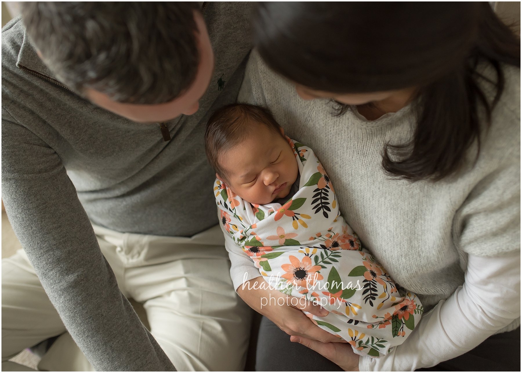 ricketti-newborn-photos-newtown-pa-19.jpg a a picture of a mother and father hugging their newborn at a photo session in newtown pa