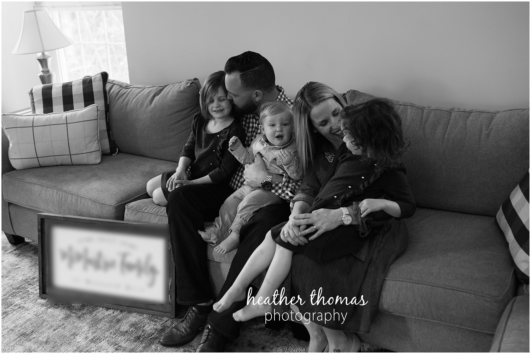 montgomery county family photographer-30.jpg a family of five sitting on their in lansdale smiling for a photo shoot with heather thomas