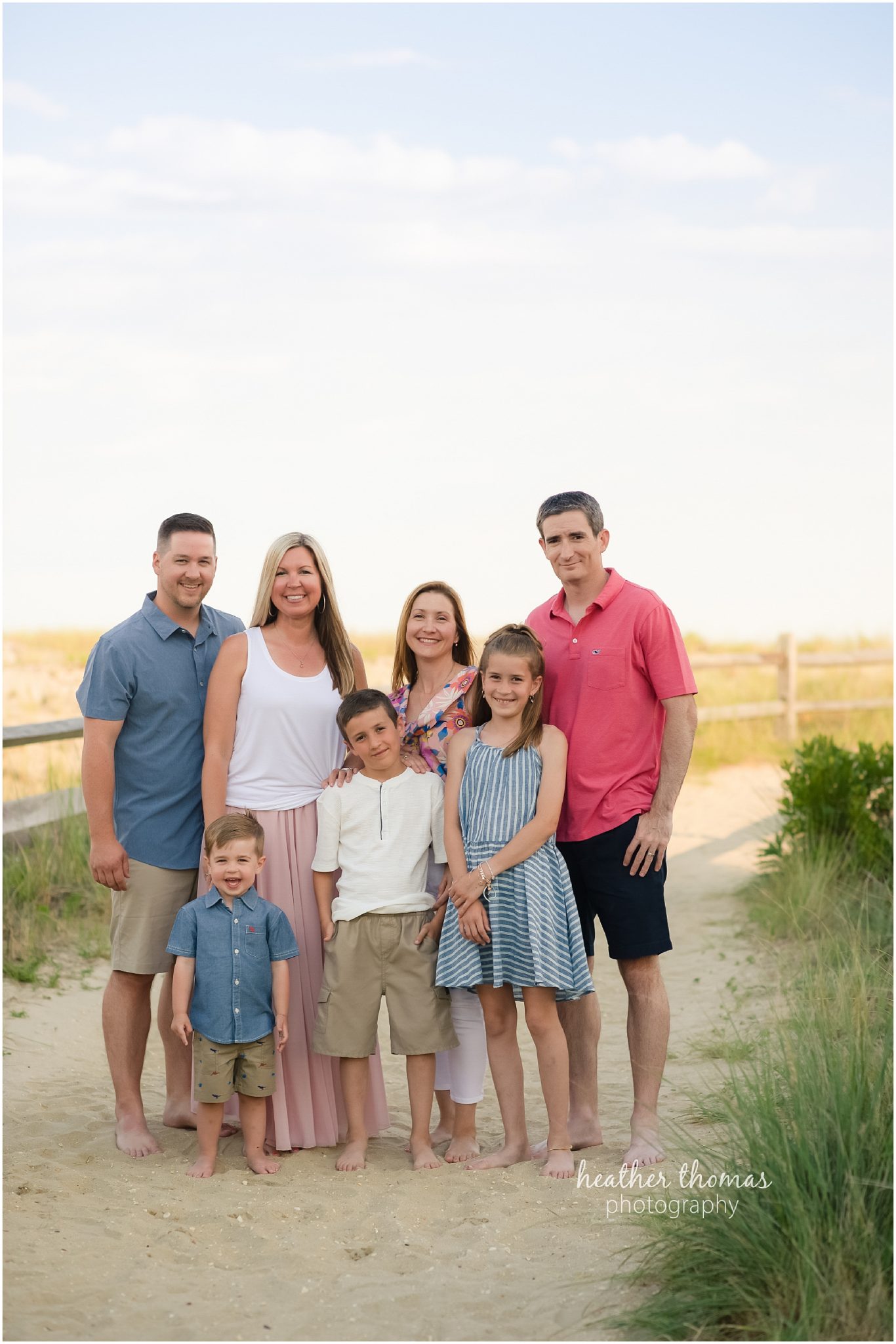 Ocean City, NJ Extended Family Photo Shoot pictures of a family dressed in blue and pink on the beach in ocean city nj