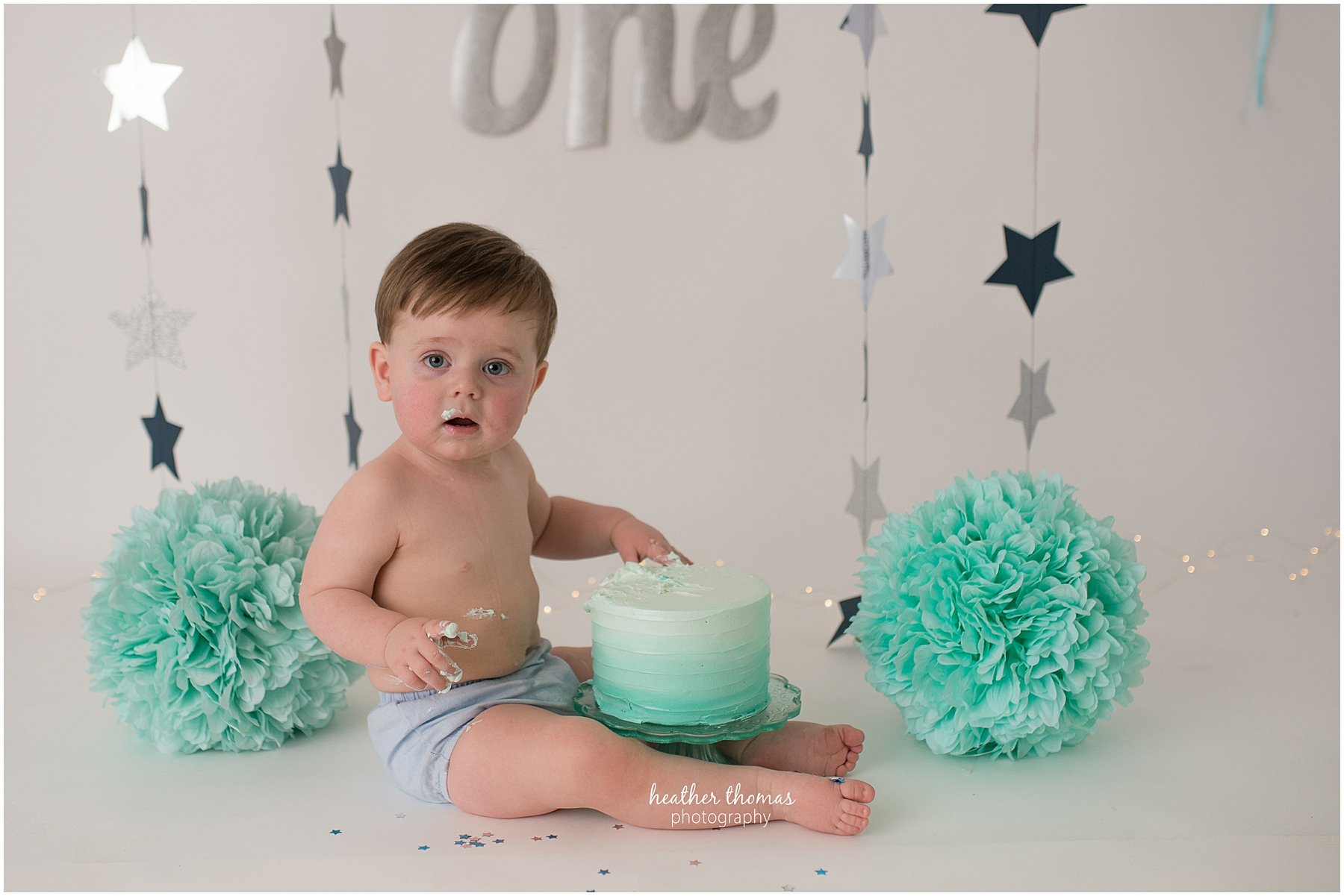 first birthday photos philadelphia-11.jpg a picture of a one year old boy at his cake smash photo shoot