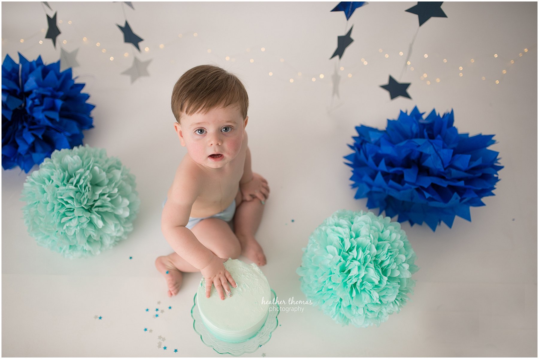 first birthday photos philadelphia-15.jpg a picture of a boy at a cake smash photo shoot in newtown pa