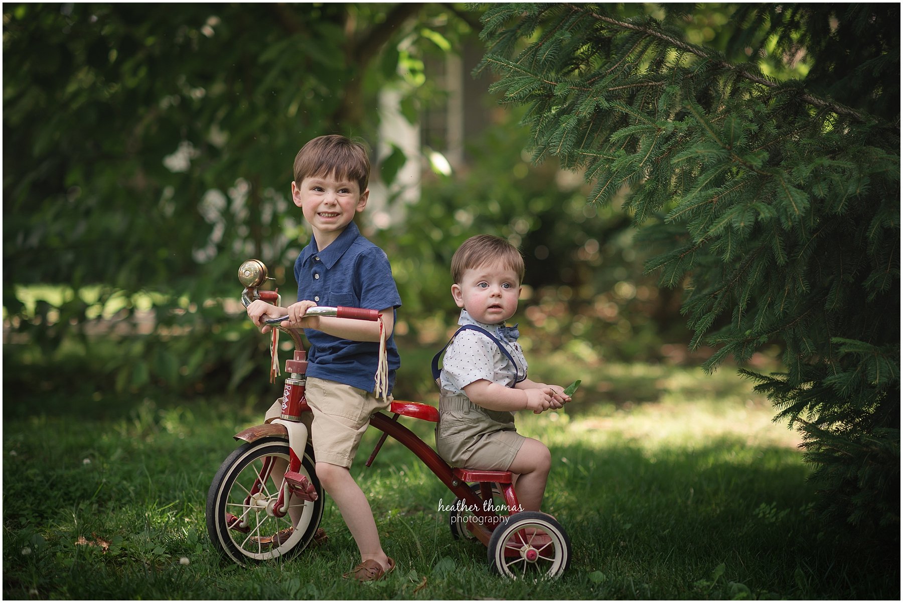 first birthday photos philadelphia-38.jpg a picture of two boys on a radio flyer tricycle
