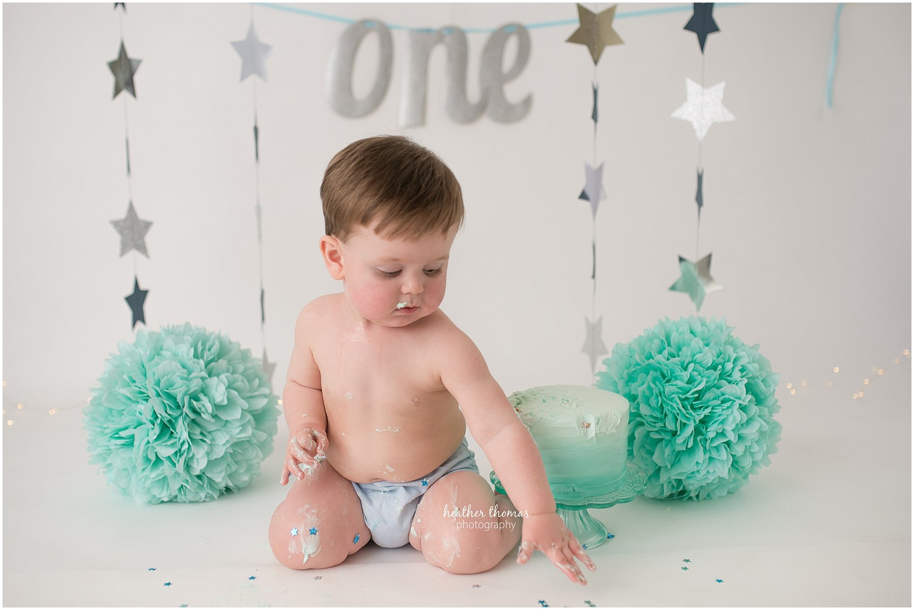 first birthday photos philadelphia-7.jpg a picture a one year old boy in a cake smash backdrop