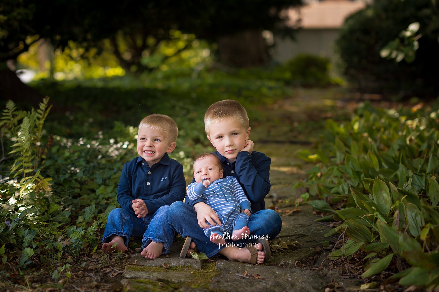 Bucks_County_PA_Newborn_Photography-27.jpg a picture of a boy at the heather thomas photography studio outside in Newtown bucks county pa