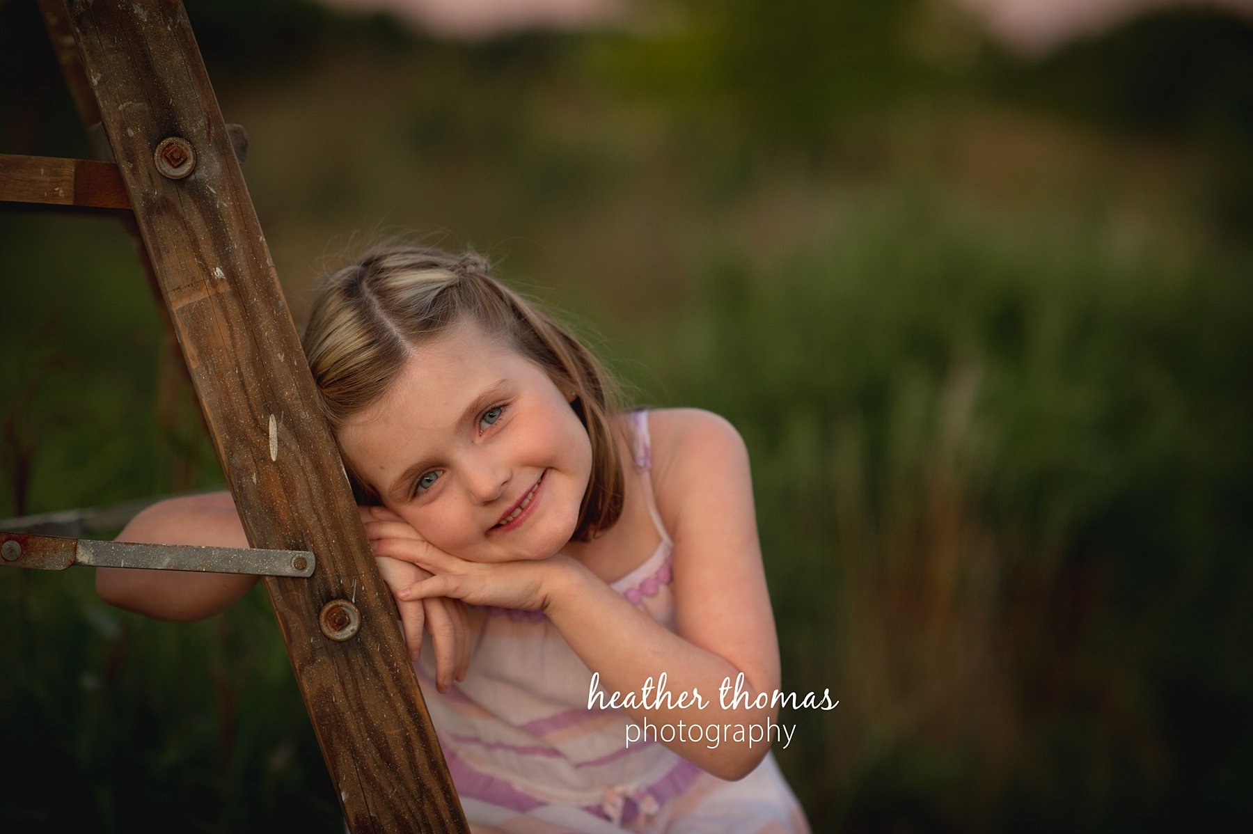 field family portraits in philadelphia a picture of a girl outside at a field in Philadelphia with heather thomas photography