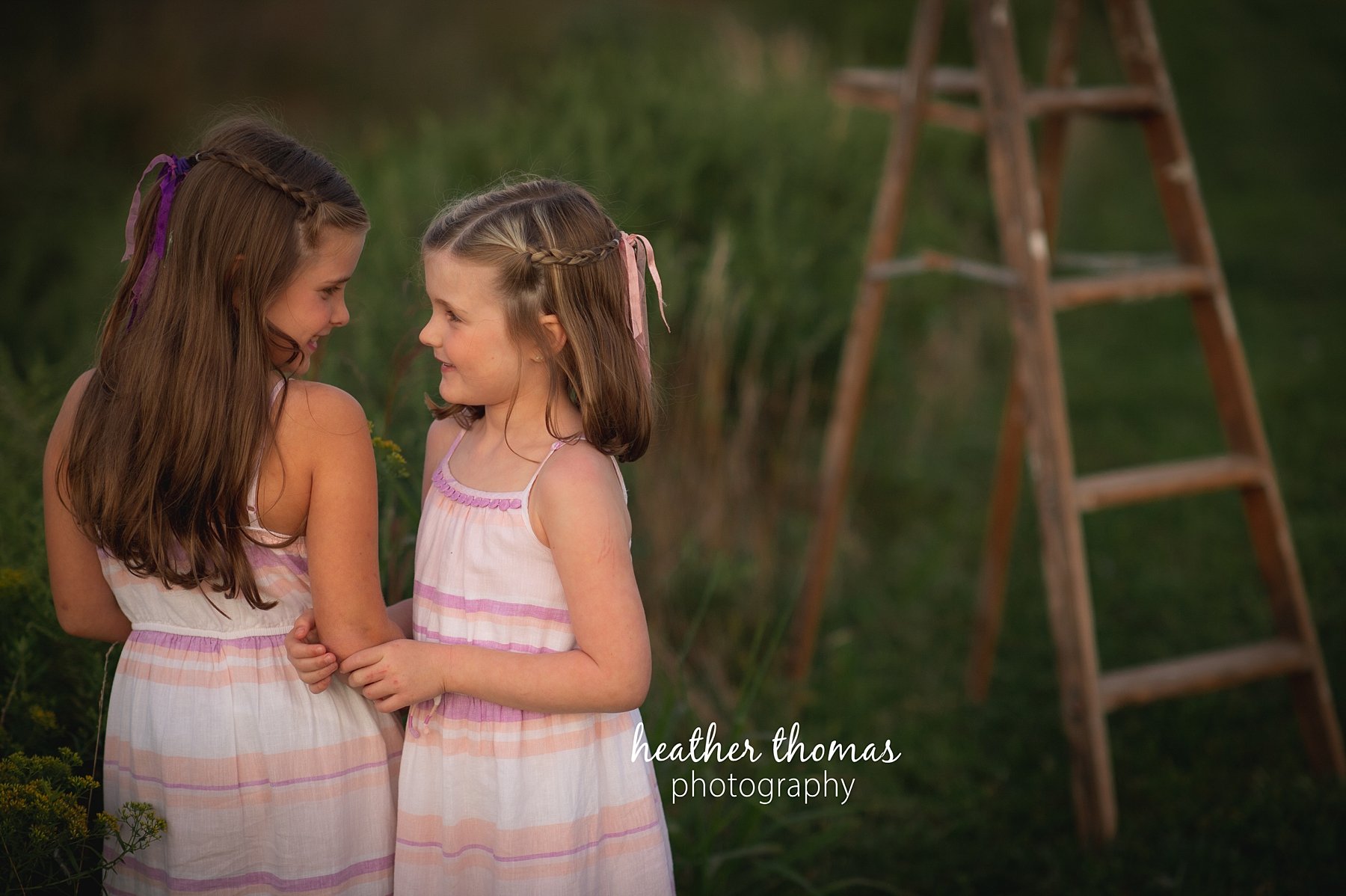 field family portraits in philadelphia a picture of a girl outside at a field in Philadelphia with heather thomas photography