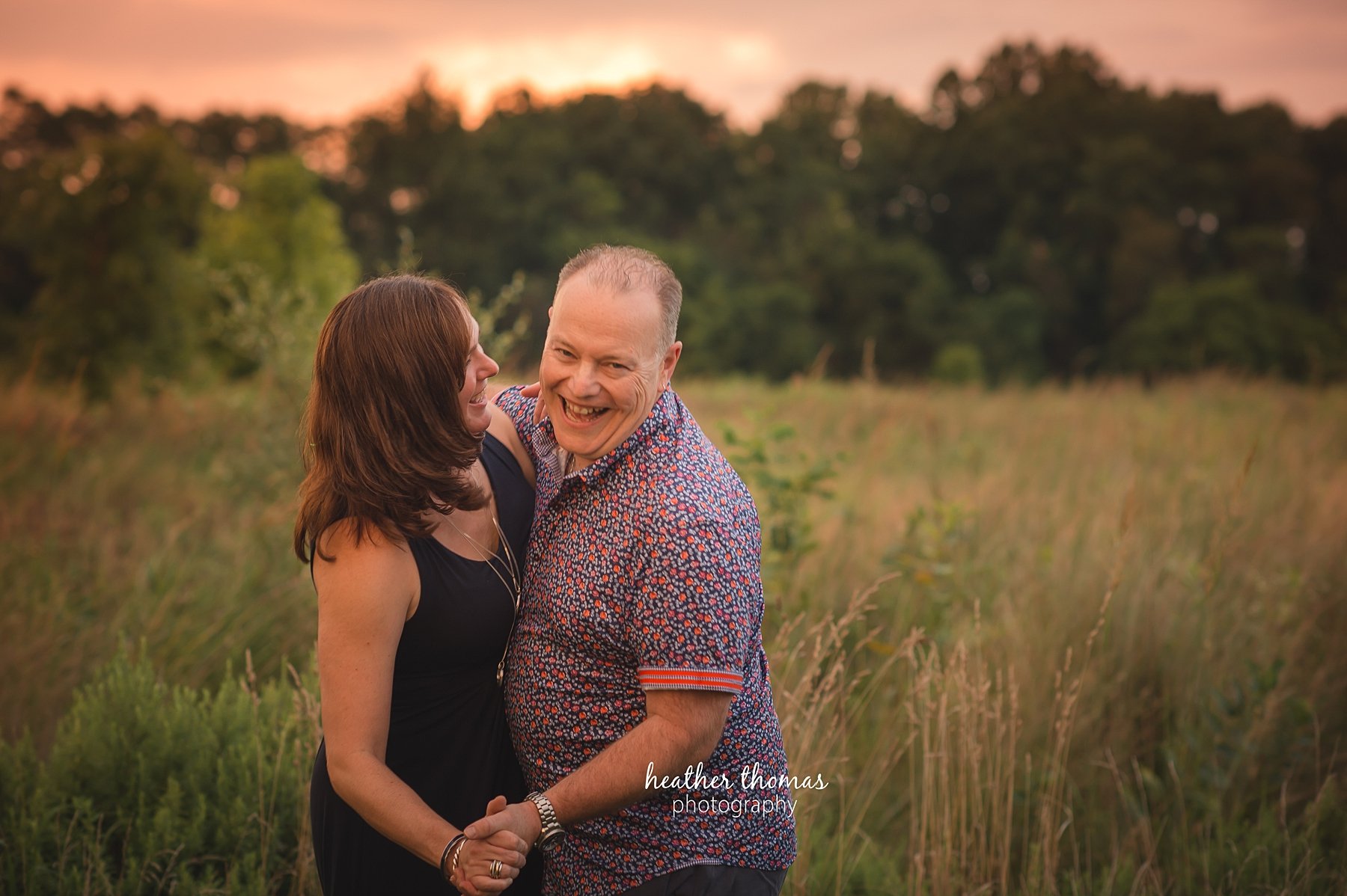 field family portraits in philadelphia a picture of a husband and wife holding hands at a photo shoot in philadelphia