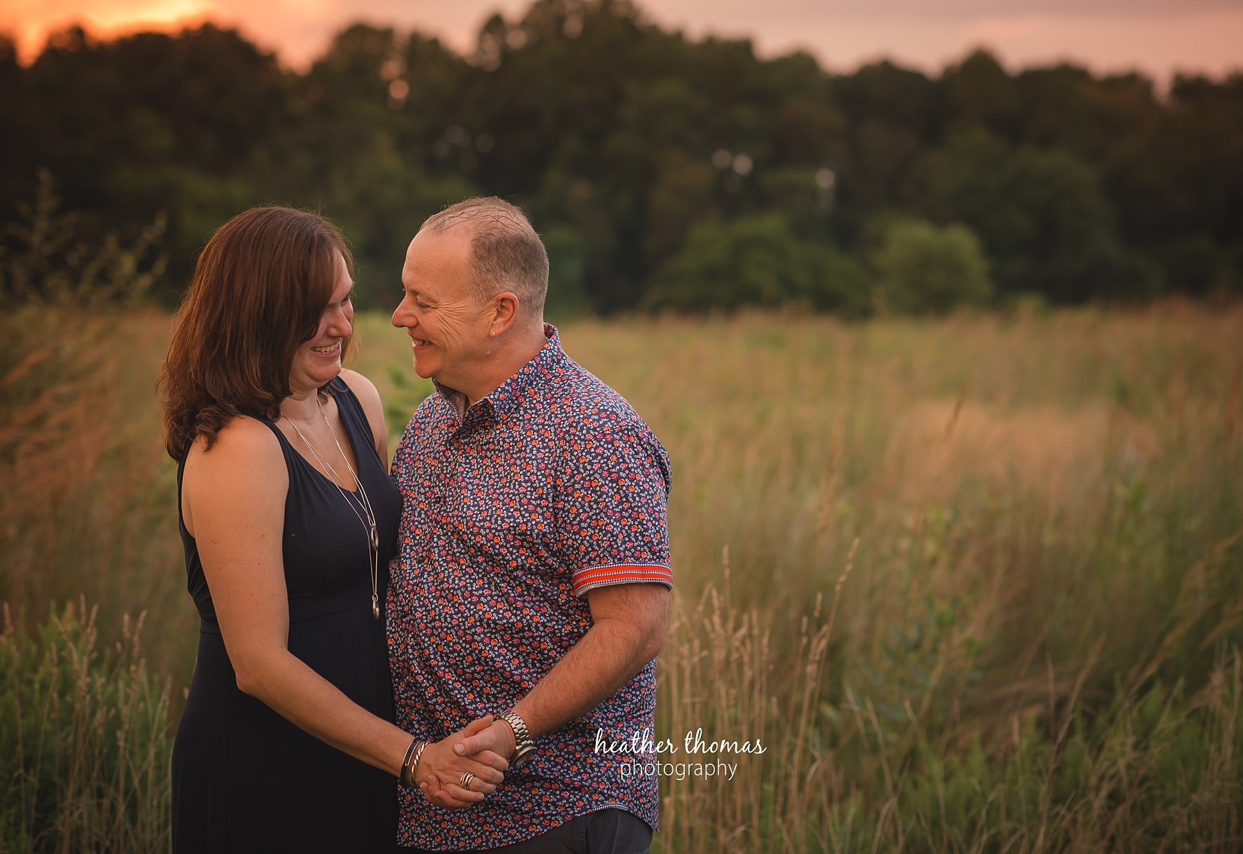 field family portraits in philadelphia husband and wife looking at each other at a photo shoot in philadelphia