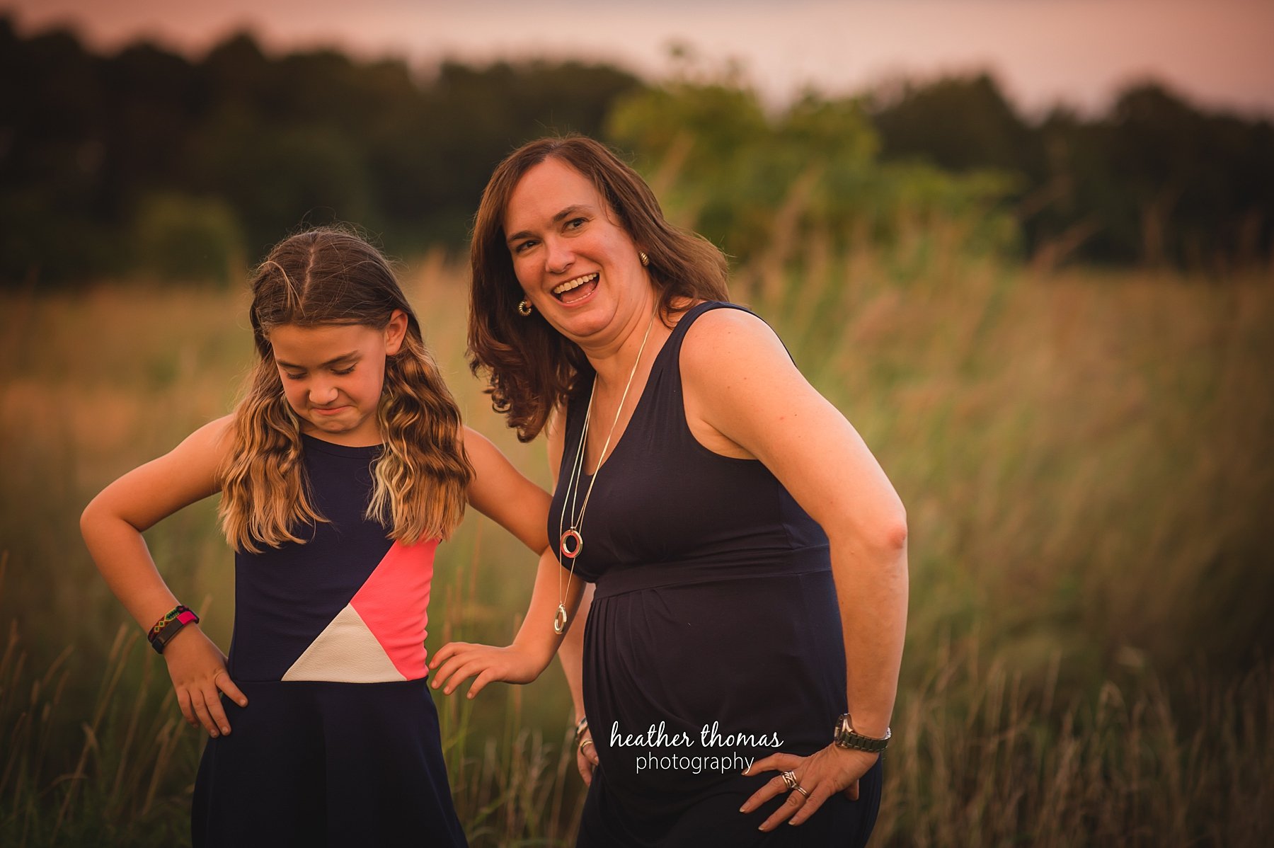 field family portraits in philadelphia a picture of a mom and her daughter posing outside in a field in philadelphia with heather thomas photography