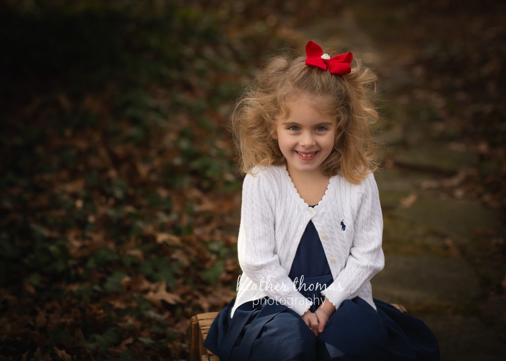Cousin Christmas Portraits in Bucks County | Washington Crossing Photographer young girl smiling for portrait