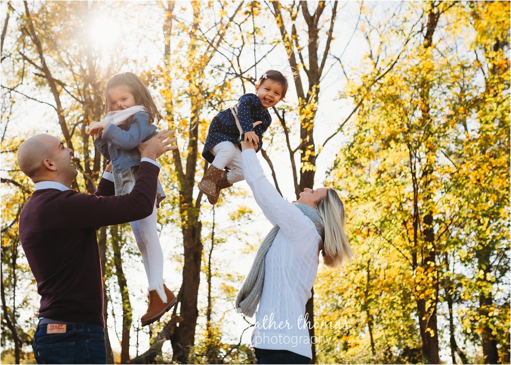 Making Memories at Home | Bucks County, PA Family Photographer family of four laughing for portrait at home