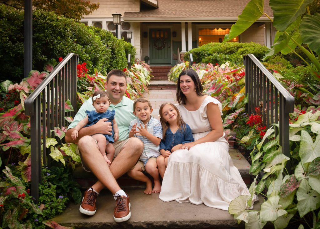 5 Family-Friendly Philadelphia Photo Shoot Locations a family of 5 sitting on the steps at sayen garden in NJ