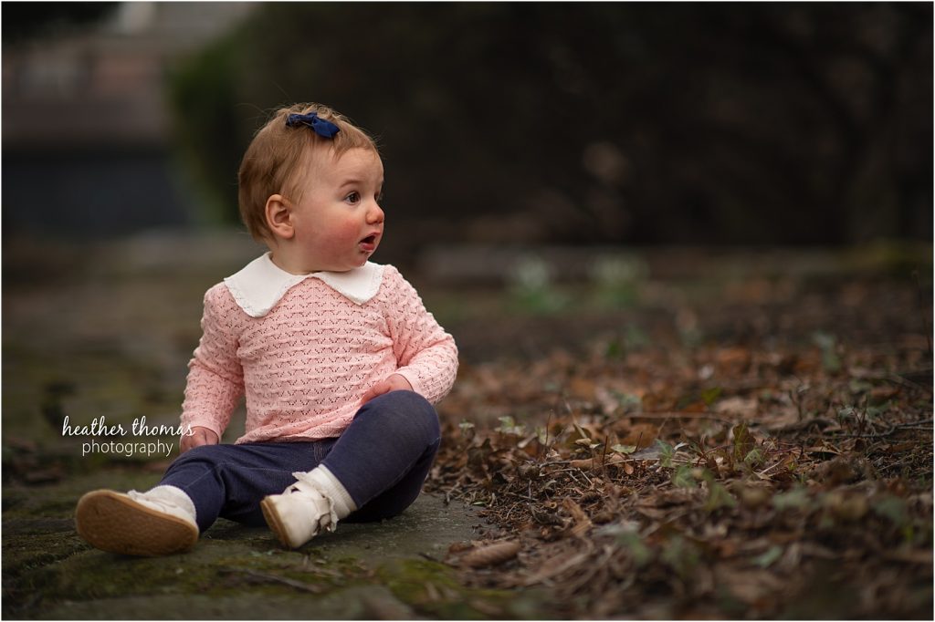A January Outdoor Family Photo Shoot in Newtown, PA with Heather Thomas Photography a family of four outside a farmhouse studio in newtown pa