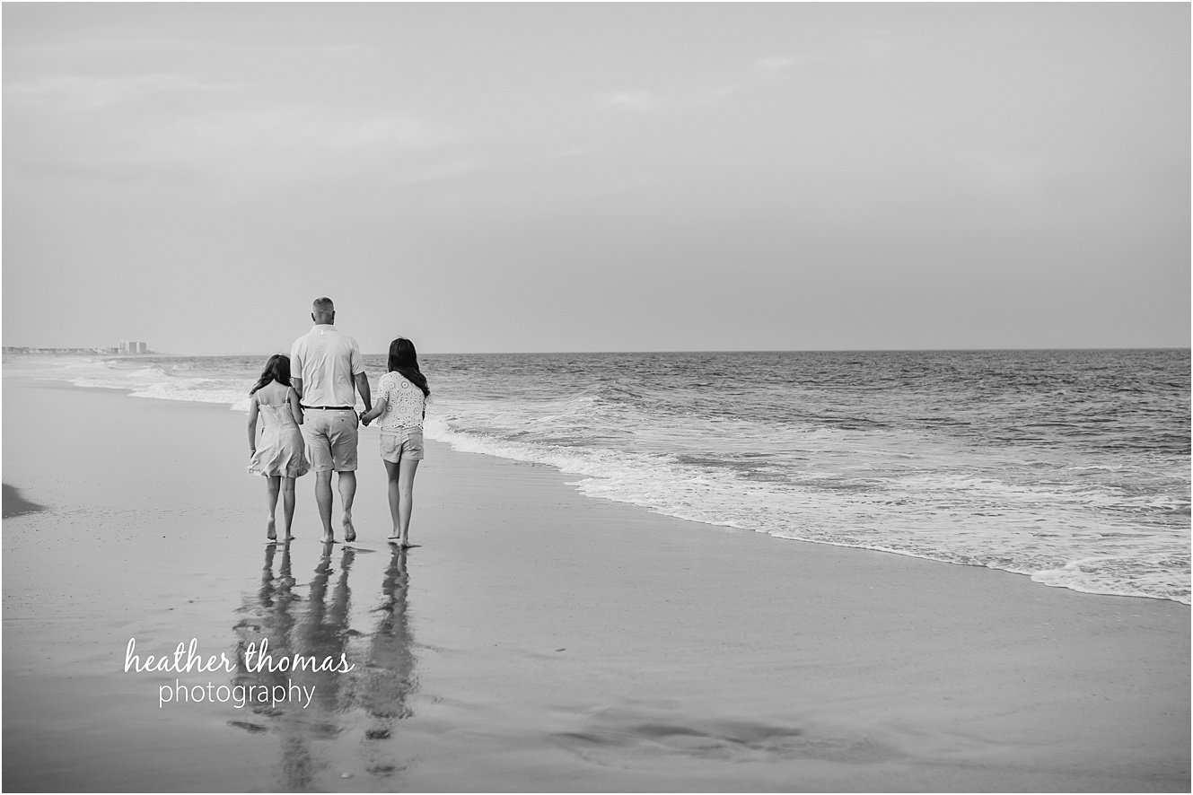 sea isle city family portraits-18.jpg a family of four at a beach photo shoot with Heather thomas photography