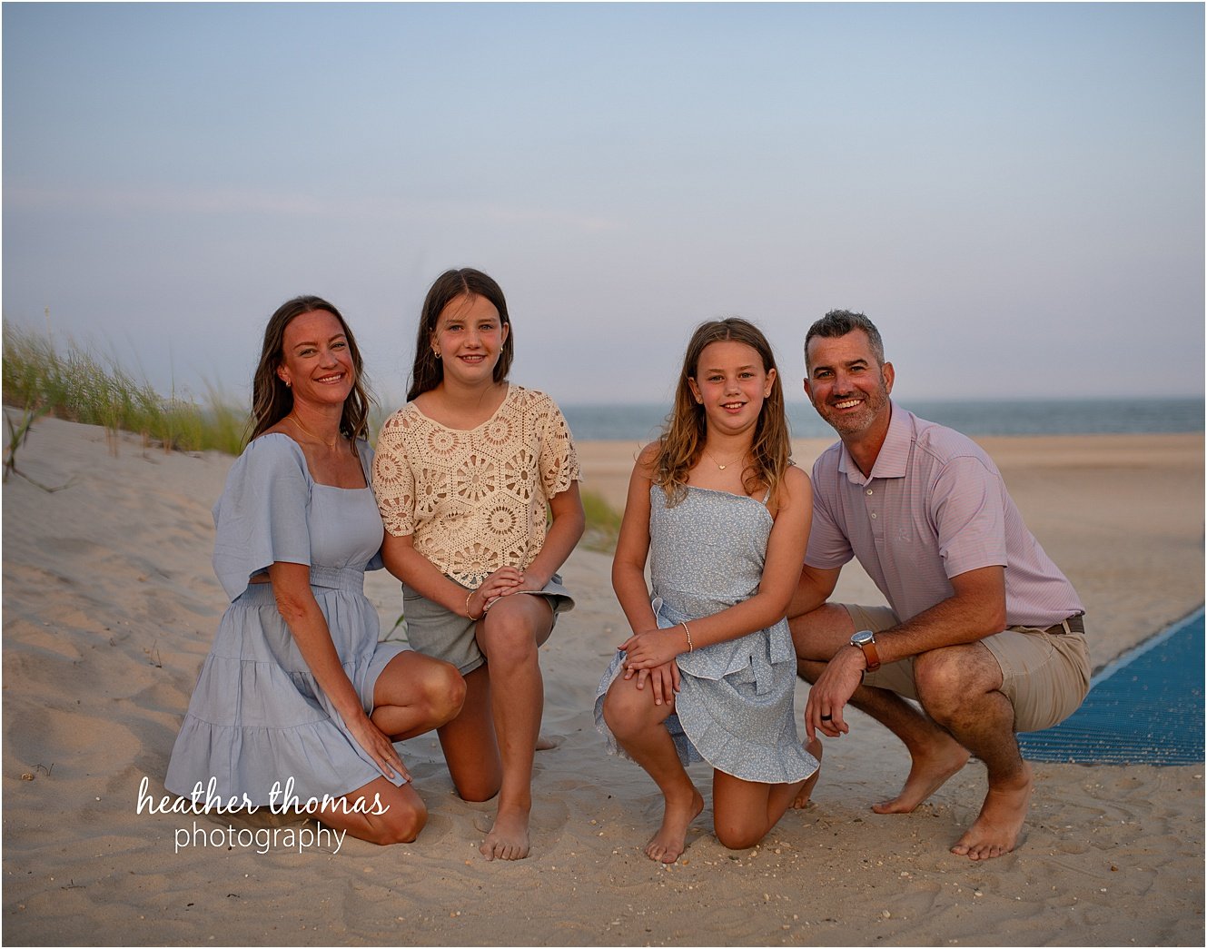 sea isle city family portraits-29.jpg a family of four at a beach photo shoot with Heather thomas photography