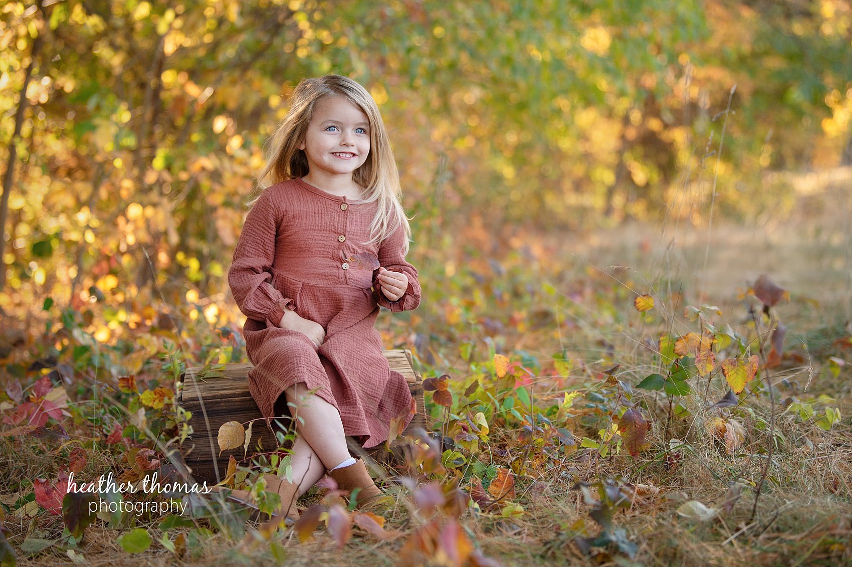 Bucks-County-Family-Photographer-Heather-Thomas-Photography-25.jpg a girl laughing at the camera in the field at a tyler state park family photography session