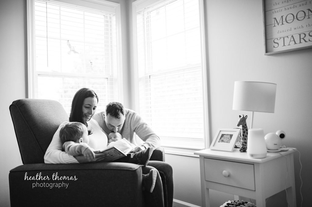 How to Prepare for an In-Home Shoot | Newborn Photography Philadelphia father kisses baby's foot after learning How to Prepare for an In-Home Shoot