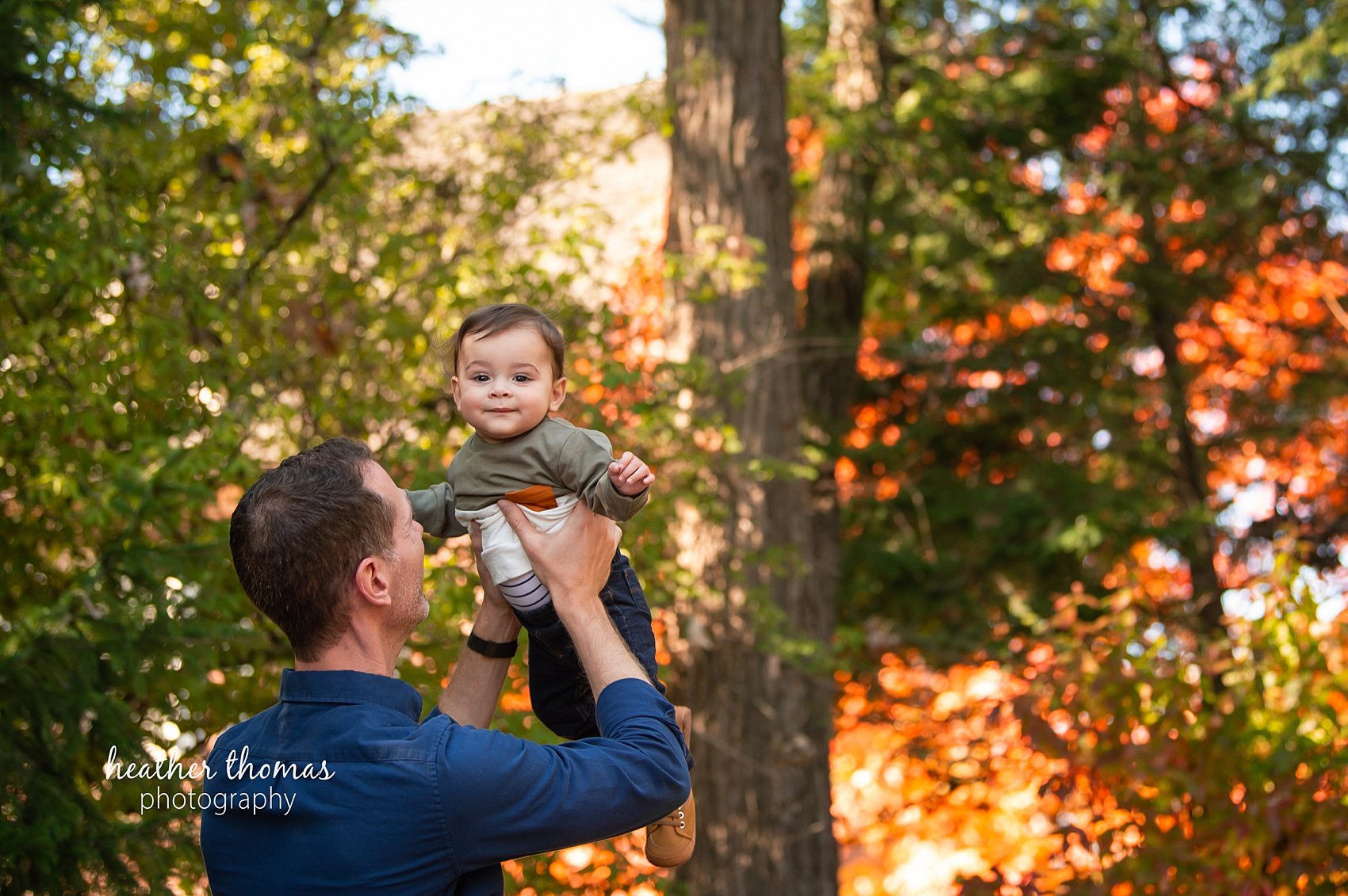 baby-photos-bucks-county-heather-thomas-photograhy-14.jpg Laughing baby boy surrounded by orange pumpkins, fall photoshoot near Philadelphia