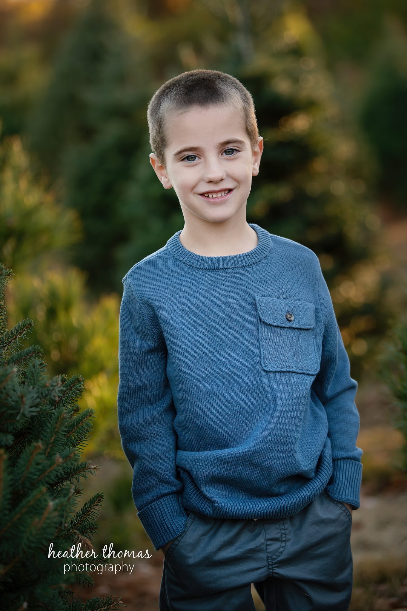 christmas-tree-farm-photo-shoot-heather-thomas-photograhy-78.jpg a professional picture of a boy at the colavita christmas tree farm in bucks county
