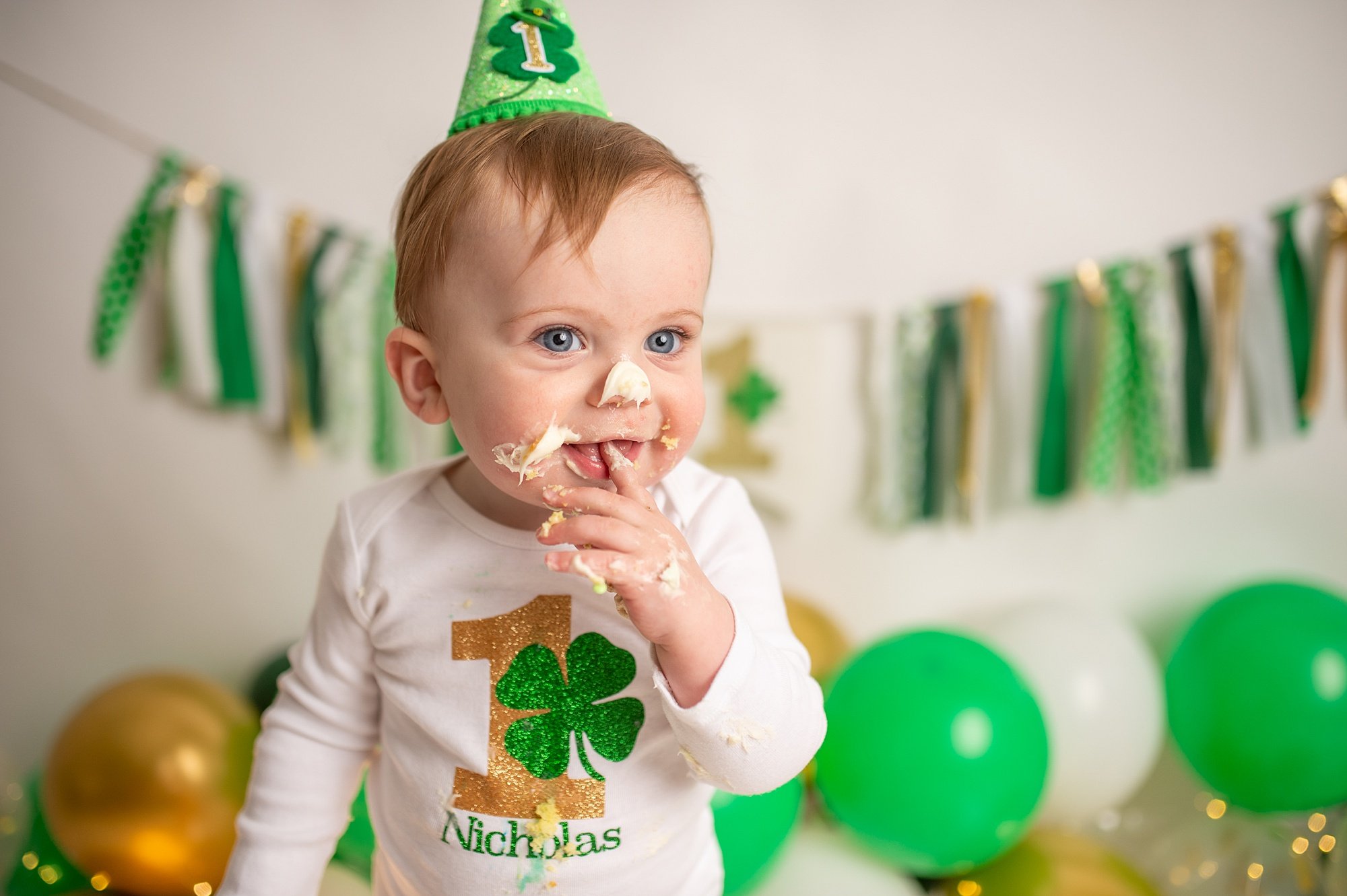 DCS_0955.jpg Philadelphia Cake Smash Photographer with baby boy in white and green at a lucky charm cake smash
