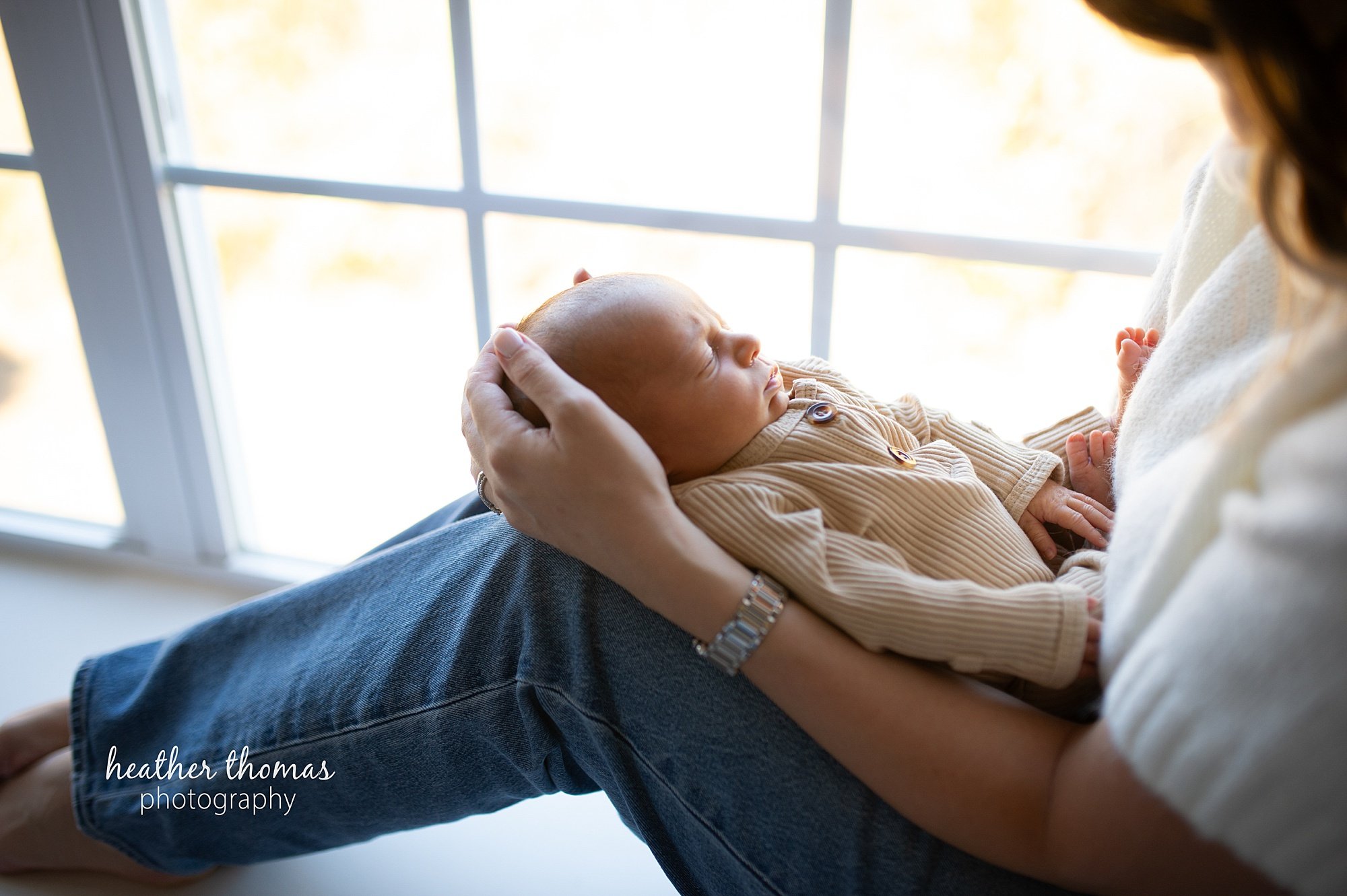 philadelphia-newborn-photogrpaher-heather-thomas-photography--02 a family holding a newborn boy during an in home lifestyle newborn photo session with heather thomas photography